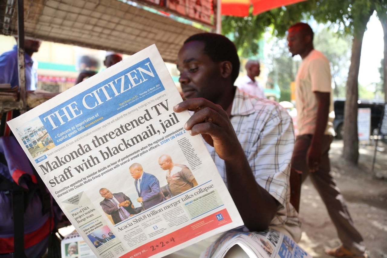 A man reads a copy of the local English-language daily "The Citizen", in Arusha, northern Tanzania, 23 March 2017, STRINGER/AFP/Getty Images