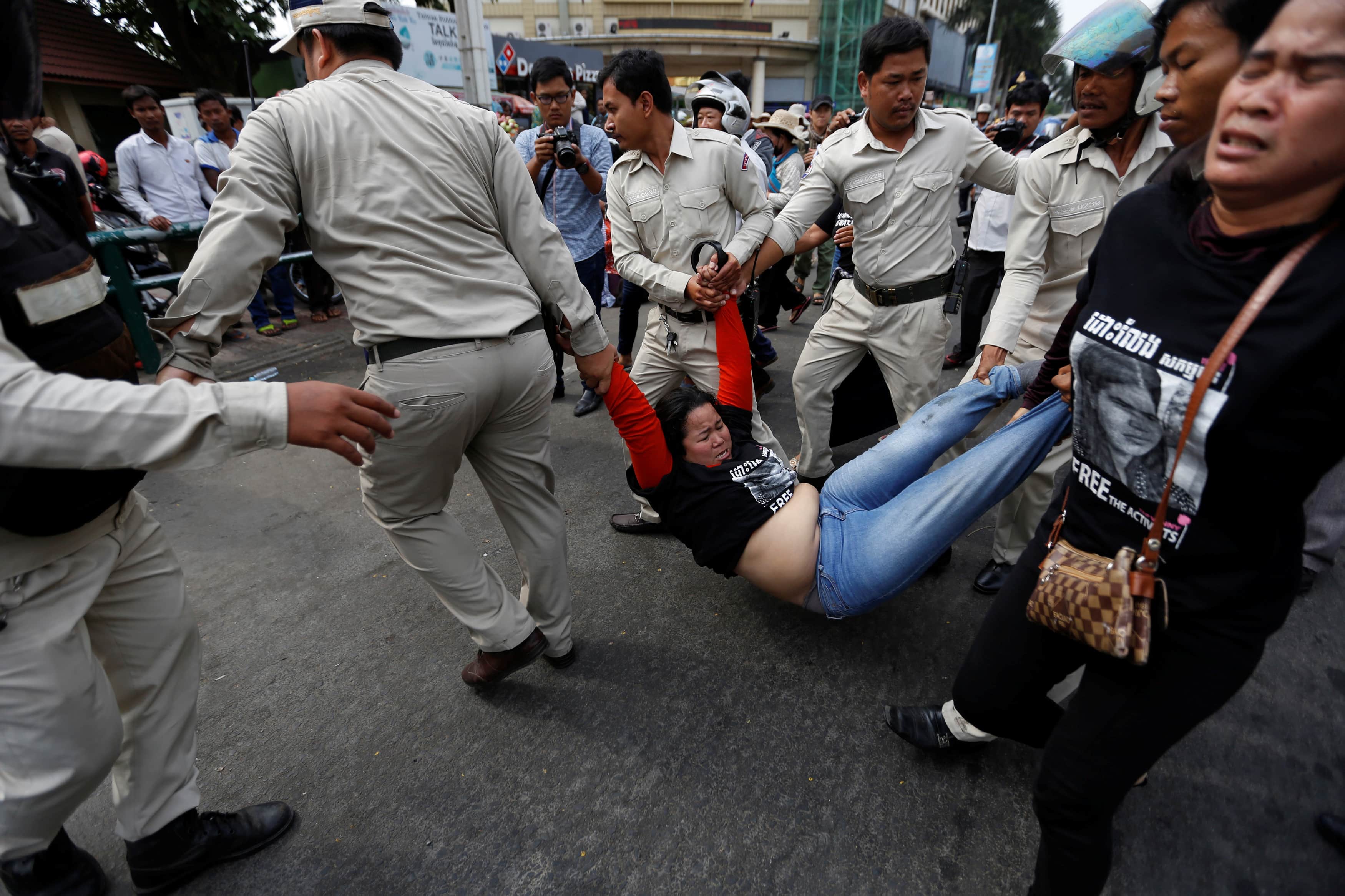 Protesters are detained by district authorities as they demonstrate in support of land rights activist Tep Vanny during her verdict in front of the Phnom Penh Municipal Court in central Phnom Penh, Cambodia, 23 February 2017, REUTERS/Samrang Pring