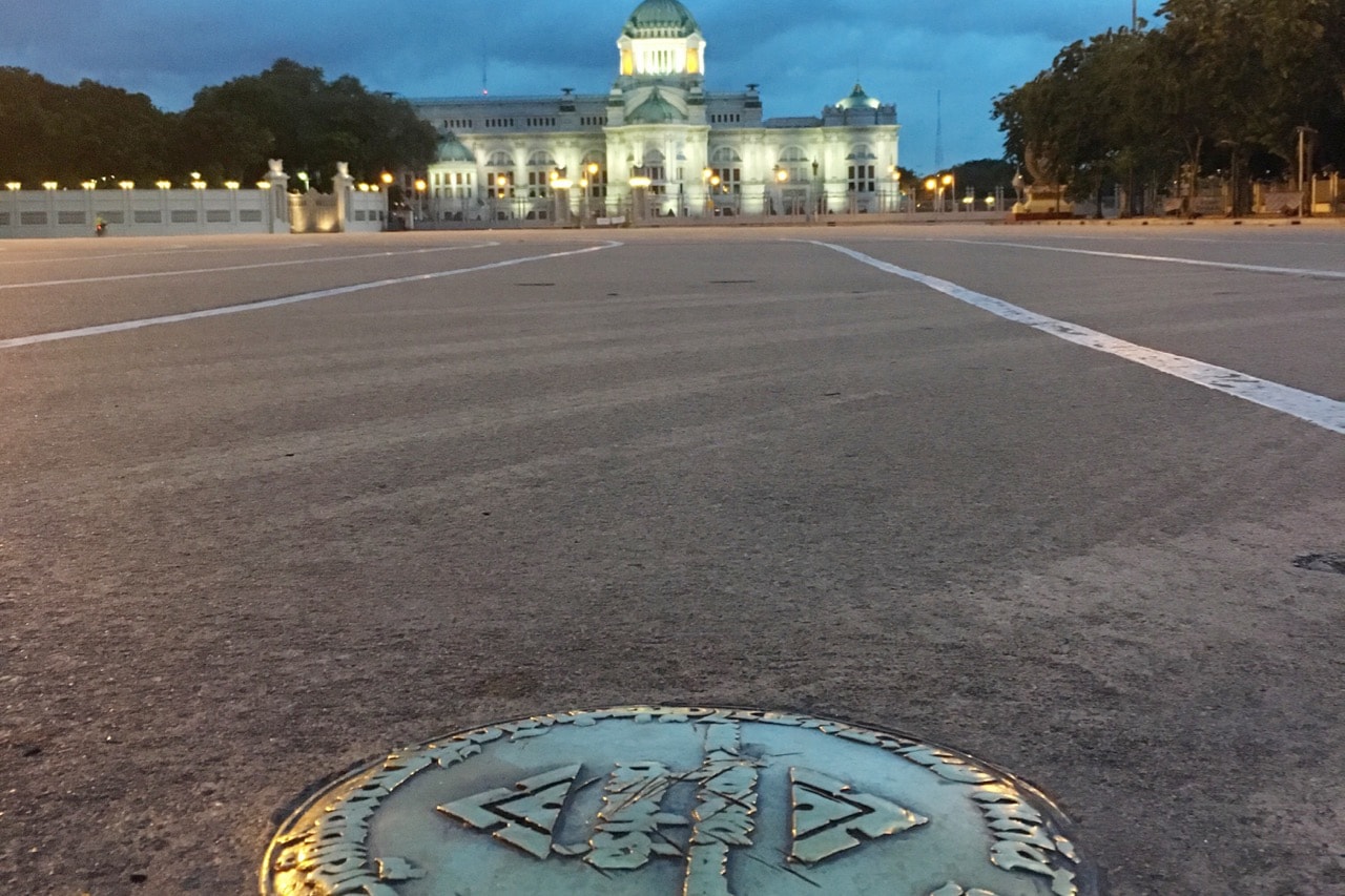 In this 2 October 2016, photo, a bronze plaque commemorating Thailand's 1932 revolution is seen in the Royal Plaza in front of the Ananta Samakhom throne hall in Bangkok, AP Photo/Apichart khunnawatbandit