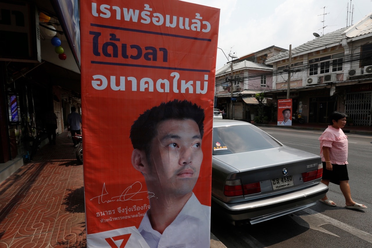 A woman walks past an electoral poster of Thanathorn Juangroongruangkit, leader of the Future Forward Party and Prime Minister candidate in Bangkok, Thailand, 12 February 2019, Chaiwat Subprasom/SOPA Images/LightRocket via Getty Images