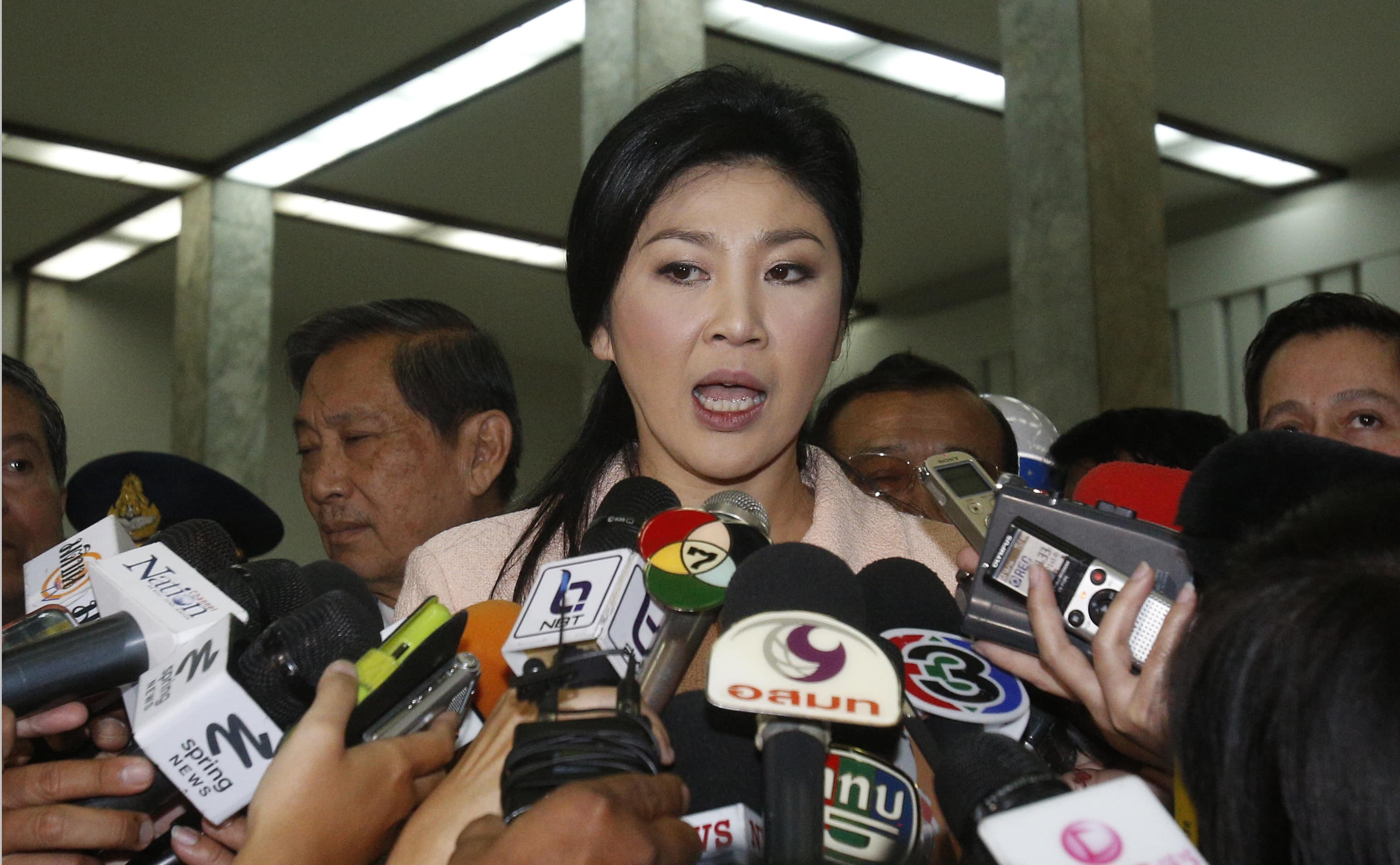 Thai Prime Minister Yingluck Shinawatra speaks to reporters following the declaration of a state of emergency in Bangkok, 21 January 2014, REUTERS/Athit Perawongmetha