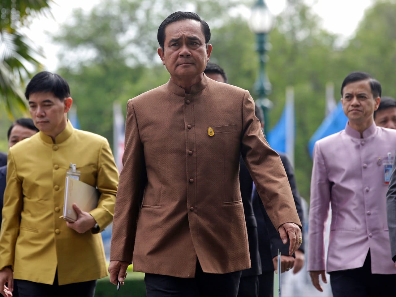 In this 1 September 2015 file photo, Thai Prime Minister Prayuth Chan-ocha, center, arrives at the government house in Bangkok, AP Photo/ Sakchai Lalit, File