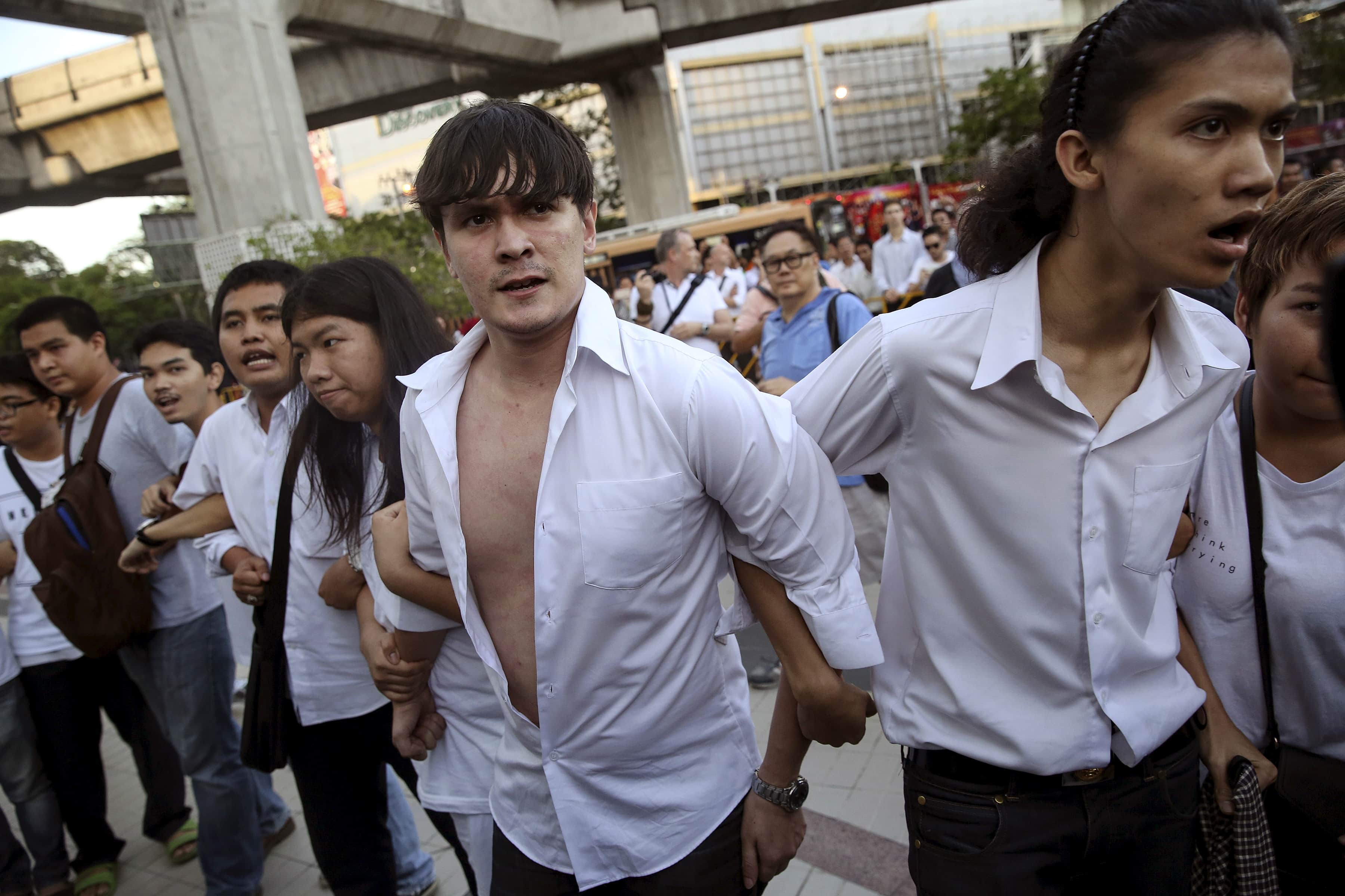 Protesters face policemen during a protest in central Bangkok, 22 May 2015, REUTERS/Damir Sagolj