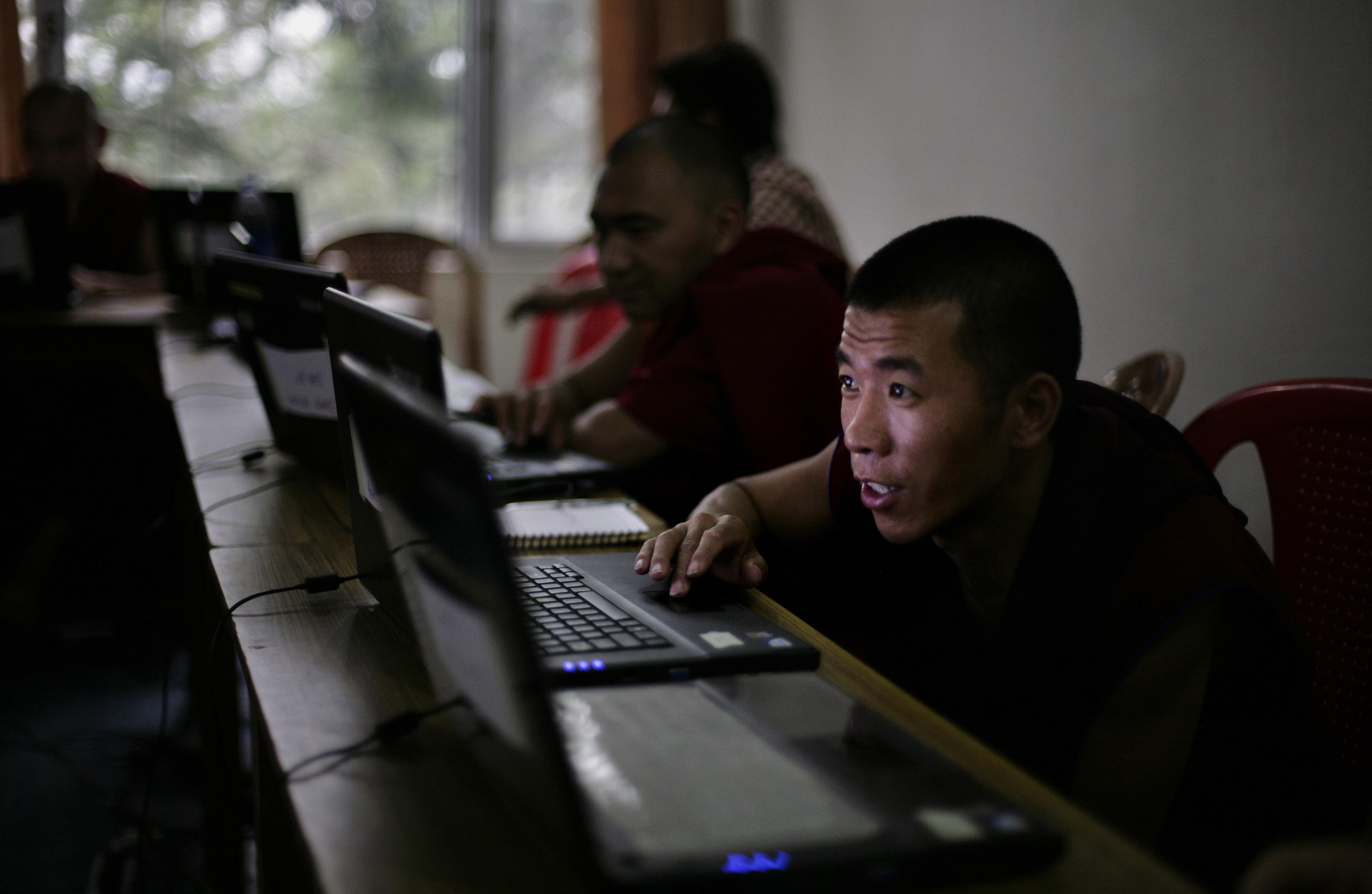 In this 7 June 2012 photo, a Tibetan Buddhist monk works on his laptop computer during a class at an educational complex in Sarah, India. , AP Photo/Altaf Qadri