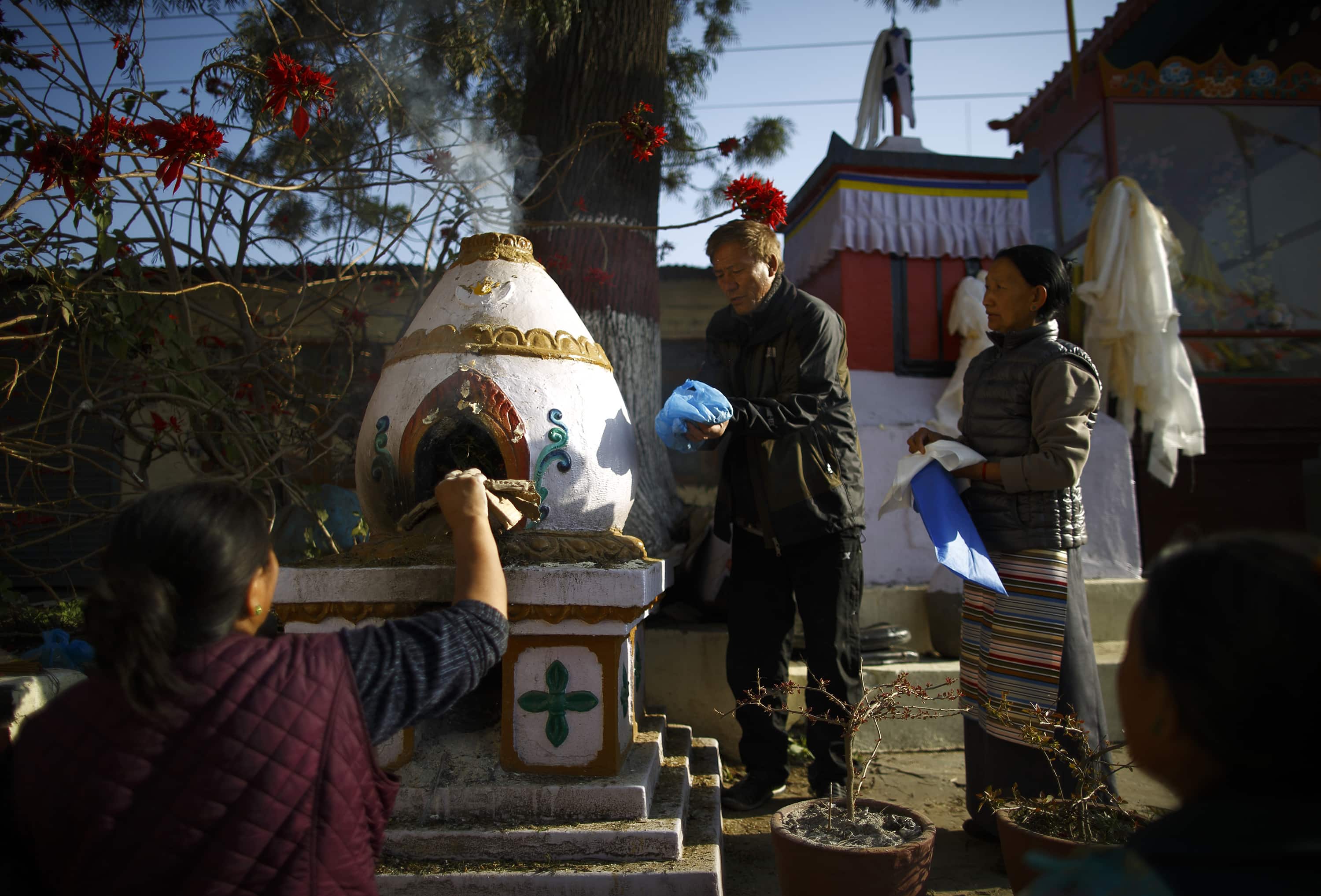 Tibetans burn incense during a private function to mark the 56th Tibetan Uprising Day at the Tibetan Refugee camp in Lalitpur on 10 March 2015, REUTERS/Navesh Chitrakar