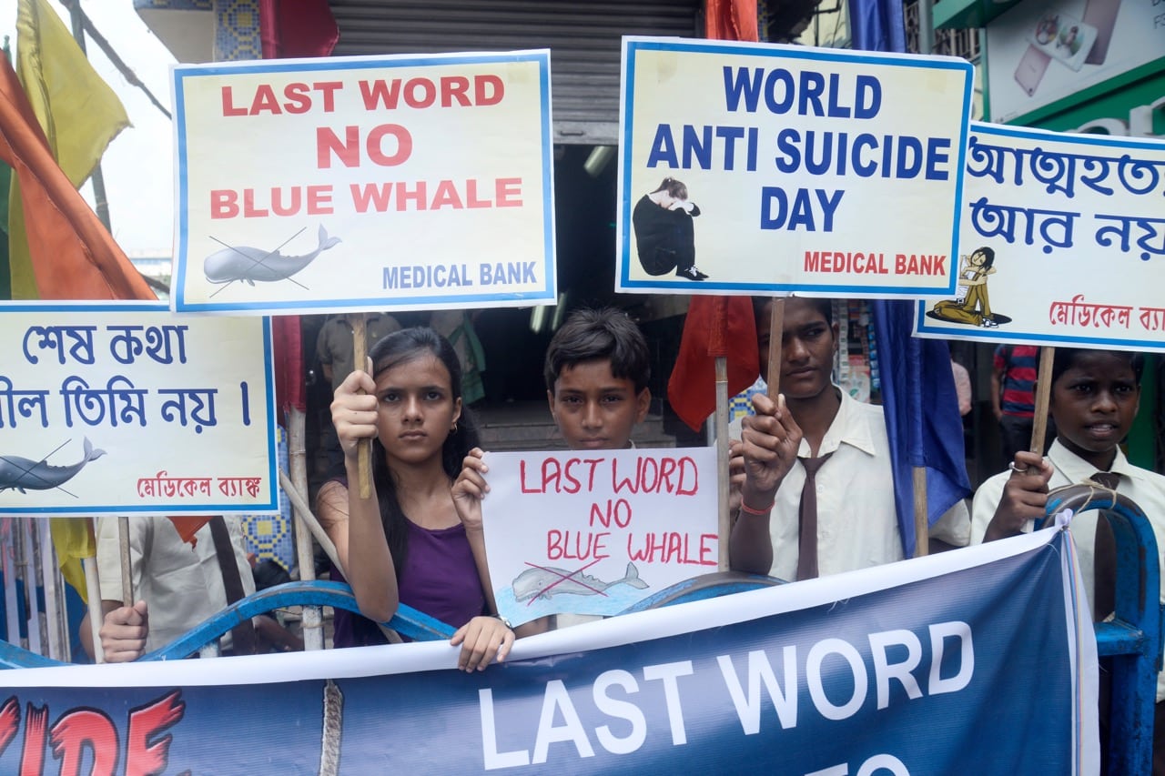 Students participate in an awareness campaign about the 'Blue Whale' game on World Suicide Prevention Day in Kolkata, India, 10 September 2017, Saikat Paul/Pacific Press/LightRocket via Getty Images