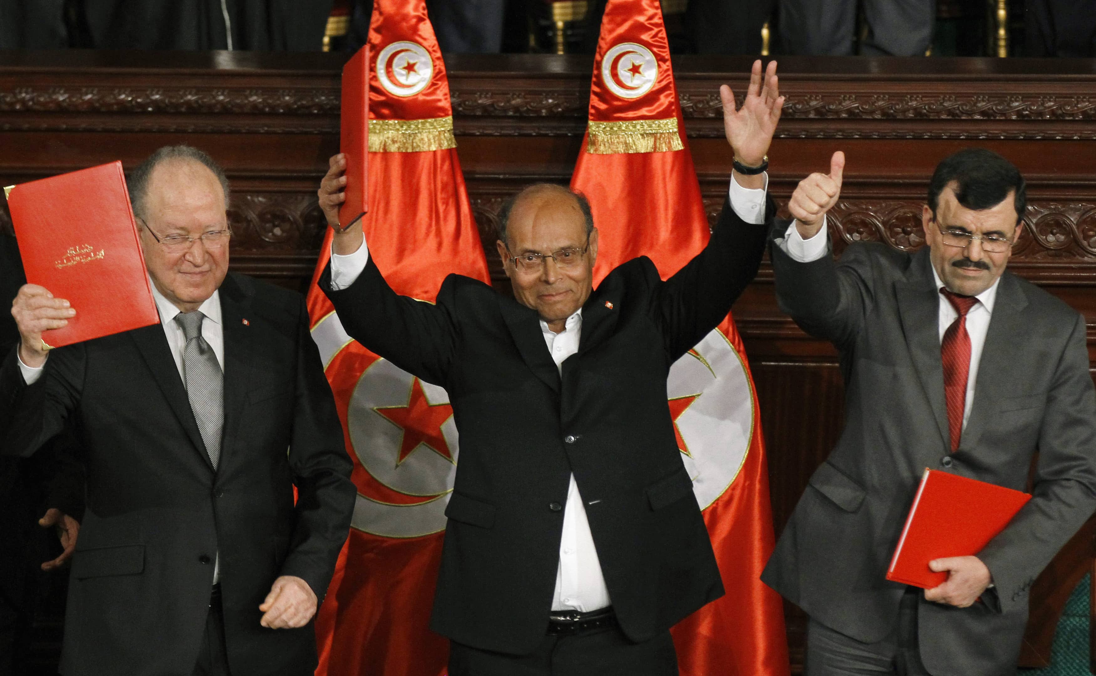 After decades of dictatorship and two years of arguments and compromises, Tunisians passed a new constitution laying the foundations for a new democracy, REUTERS/Anis Mili