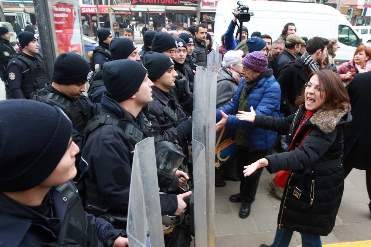 University students and academics face riot police during a protest against the dismissal of academics from universities, outside a university campus in Ankara, Turkey, 10 February 2017 , ADEM ALTAN/AFP/Getty Images