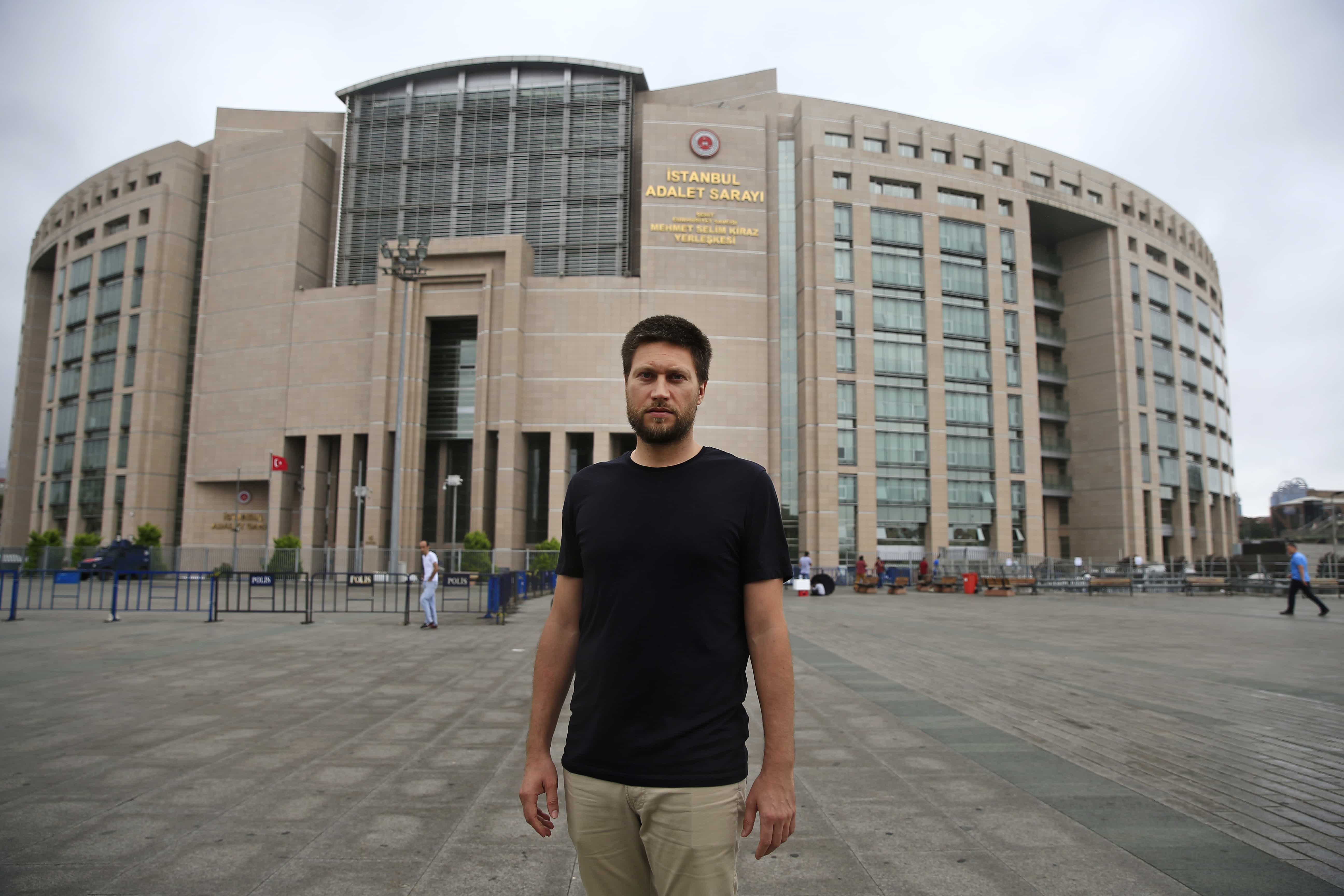 Andrew Gardner, researcher on Turkey for Amnesty International, poses for photographers outside Istanbul's court, 17 July 2017, AP Photo/Lefteris Pitarakis