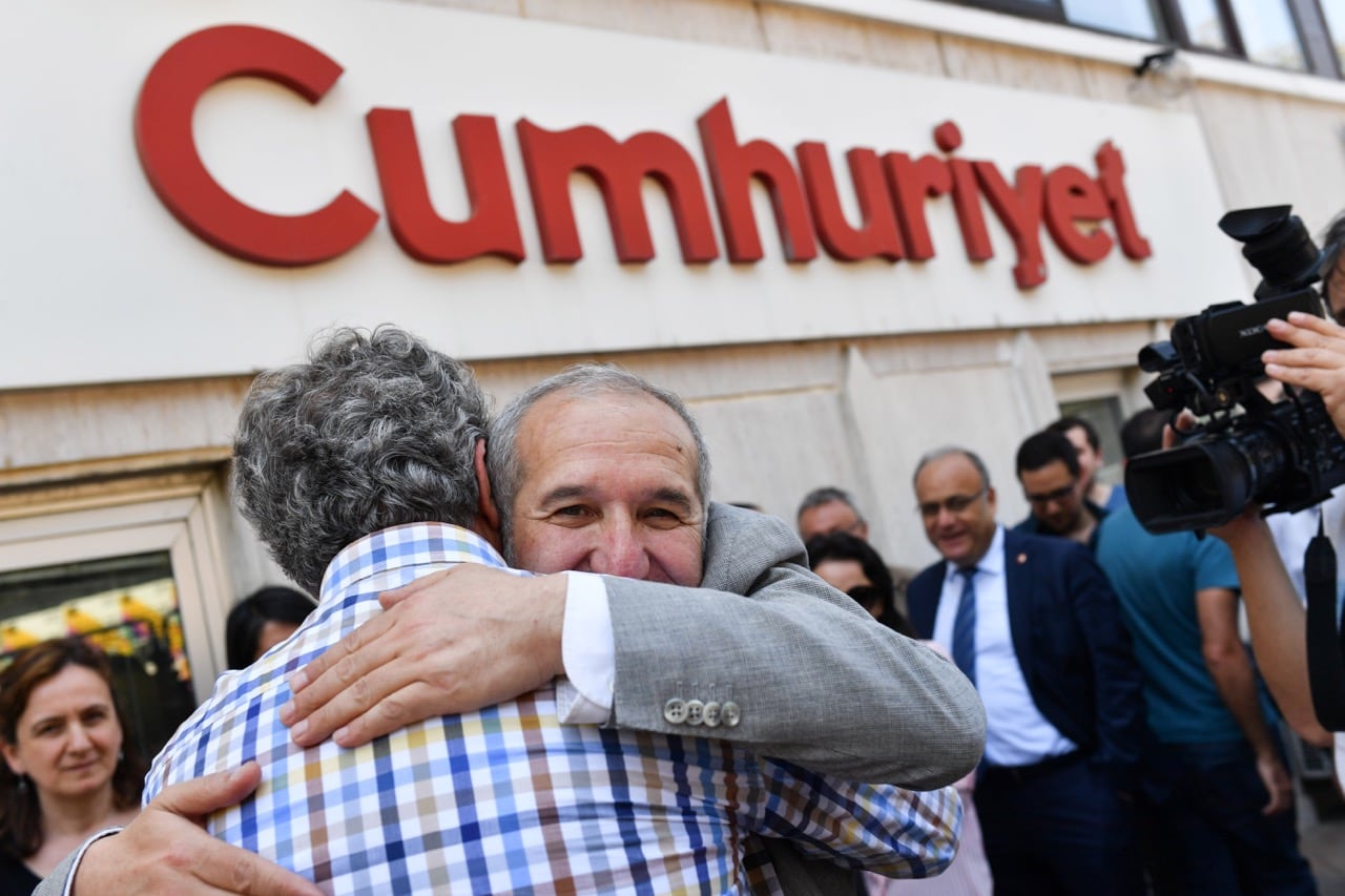 "Cumhuriyet" chairman Akin Atalay greets friends after being released from Silivri prison in front of the "Cumhuriyet" newspaper's headquarters in Istanbul, Turkey, 26 April 2018, BULENT KILIC/AFP/Getty Images