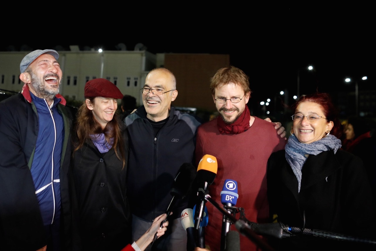 German citizen Peter Frank Steudtner (2nd R) and Swedish citizen Ali Gharavi (3rd L) talk to journalists after being released from the Silivri prison complex near Istanbul, Turkey, 26 October 2017, REUTERS/Osman Orsal