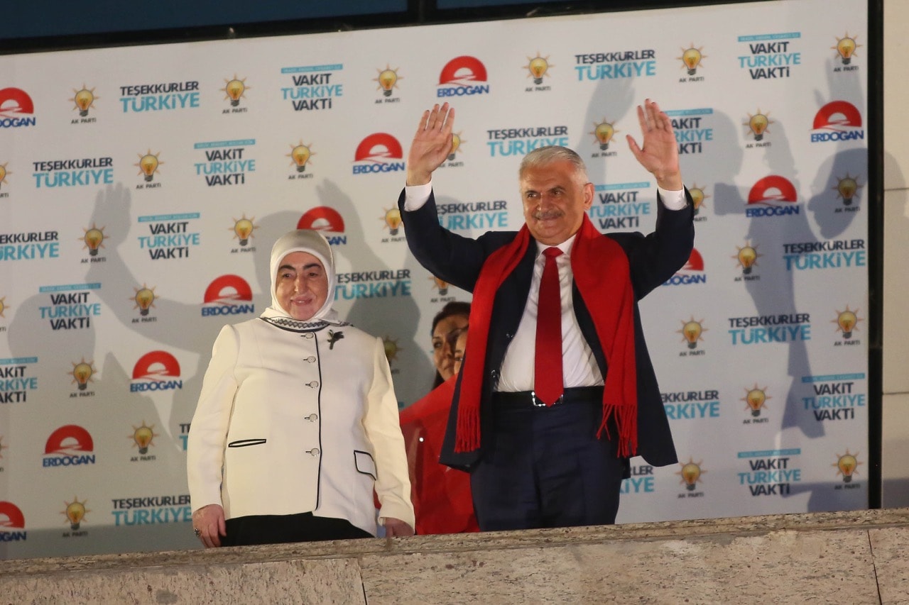 Turkey's then Prime Minister Binali Yildirim and his wife Semiha greet supporters gathered in front of the AKP Party headquarters in Ankara, Turkey, 25 June 2018, Mustafa Kirazli/Getty Images
