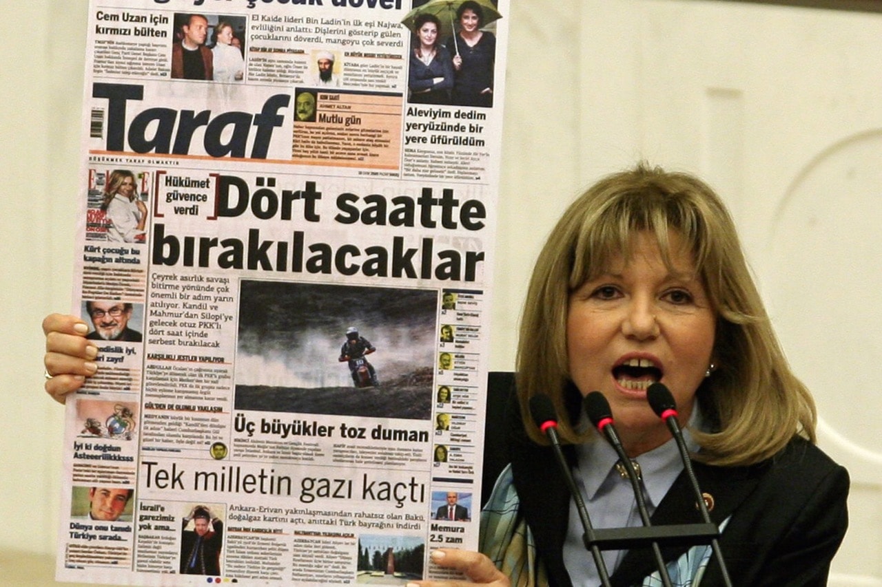 Lawmaker Nur Serter of the opposition Republican People's Party holds a copy of "Taraf" newspaper during a debate in parliament in Ankara, Turkey, 25 February 2010, ADEM ALTAN/AFP/Getty Images