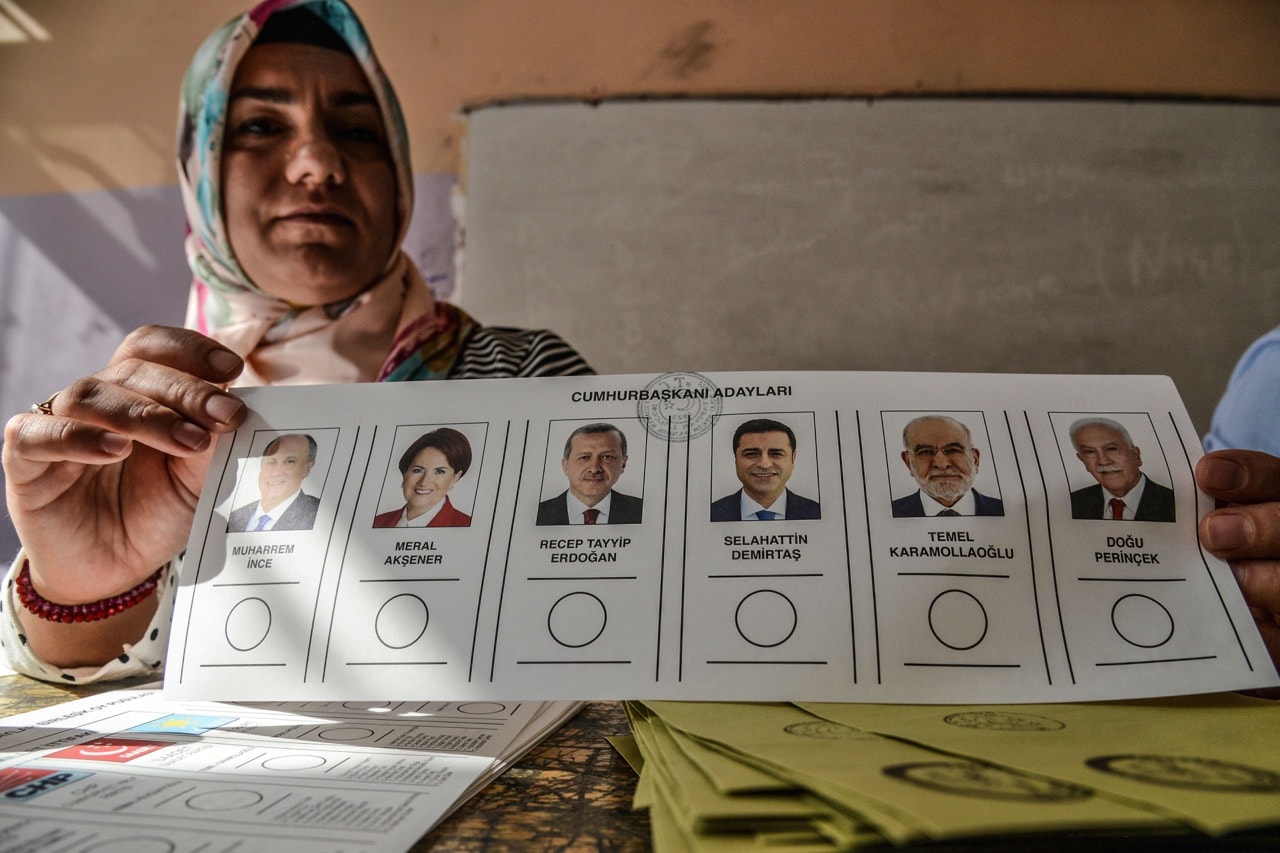 A woman shows a ballot paper at a polling station in snap twin Turkish presidential and parliamentary elections in the Kurdish stronghold of Diyarbakir, 24 June 2018, ILYAS AKENGIN/AFP/Getty Images