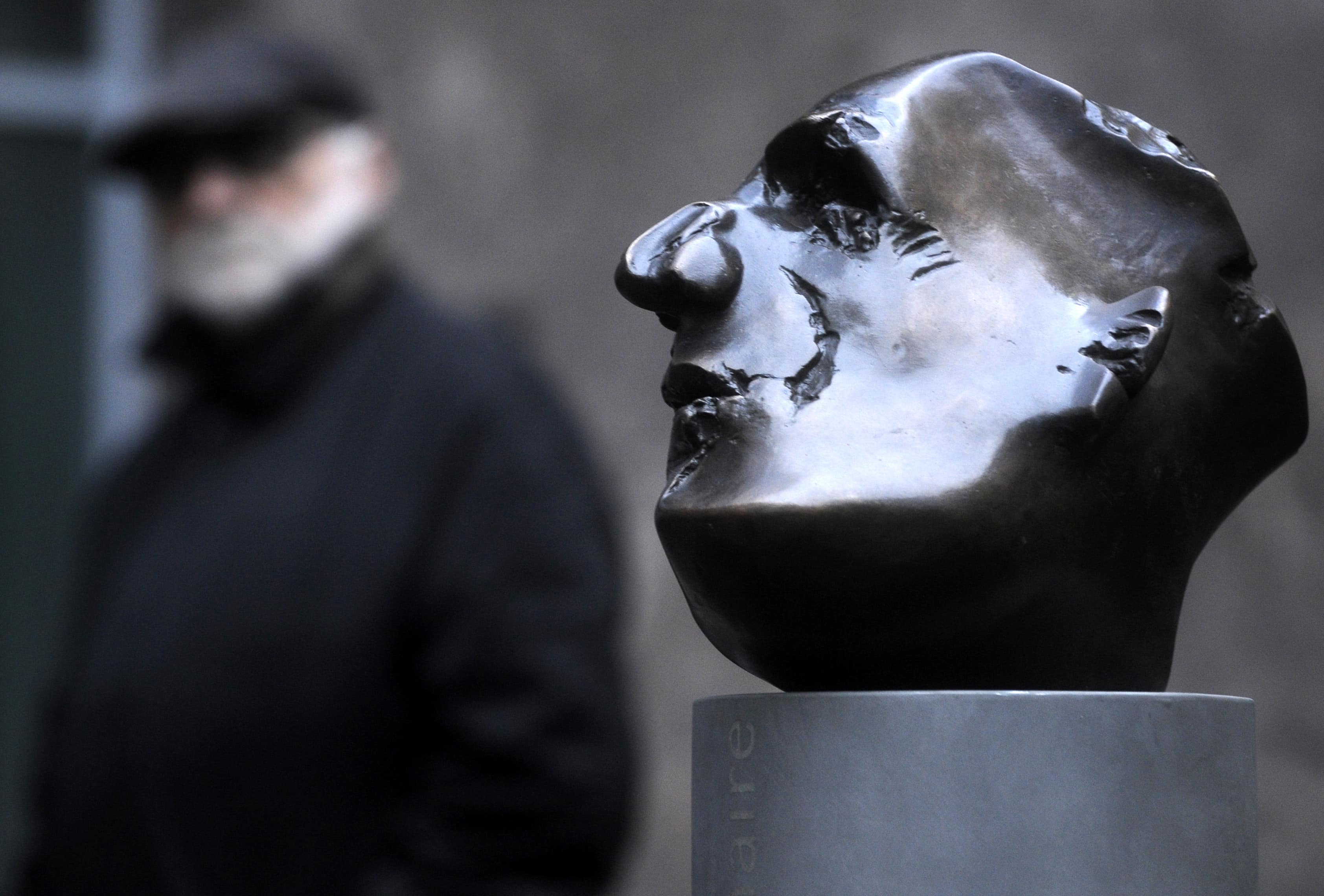 A man contemplates the bust of French poet Guillaume Apollinaire (1880-1918) next to the Archa Theatre in Prague, 29 March 2013., Photo/Vit Simanek (CTK via AP Images)