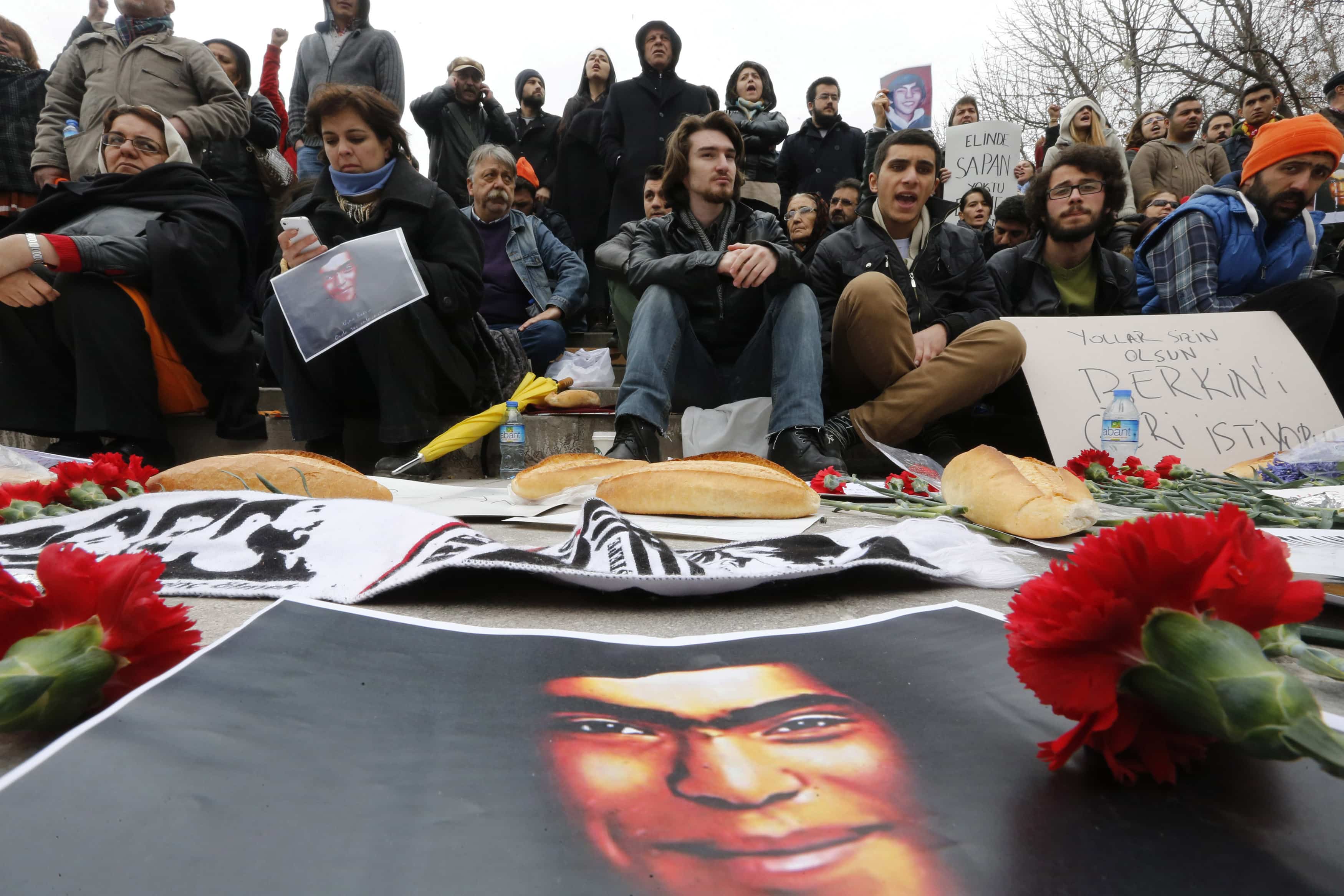 People gather around a poster of Berkin Elvan during a demonstration in Ankara, 11 March 2014., REUTERS/Umit Bektas
