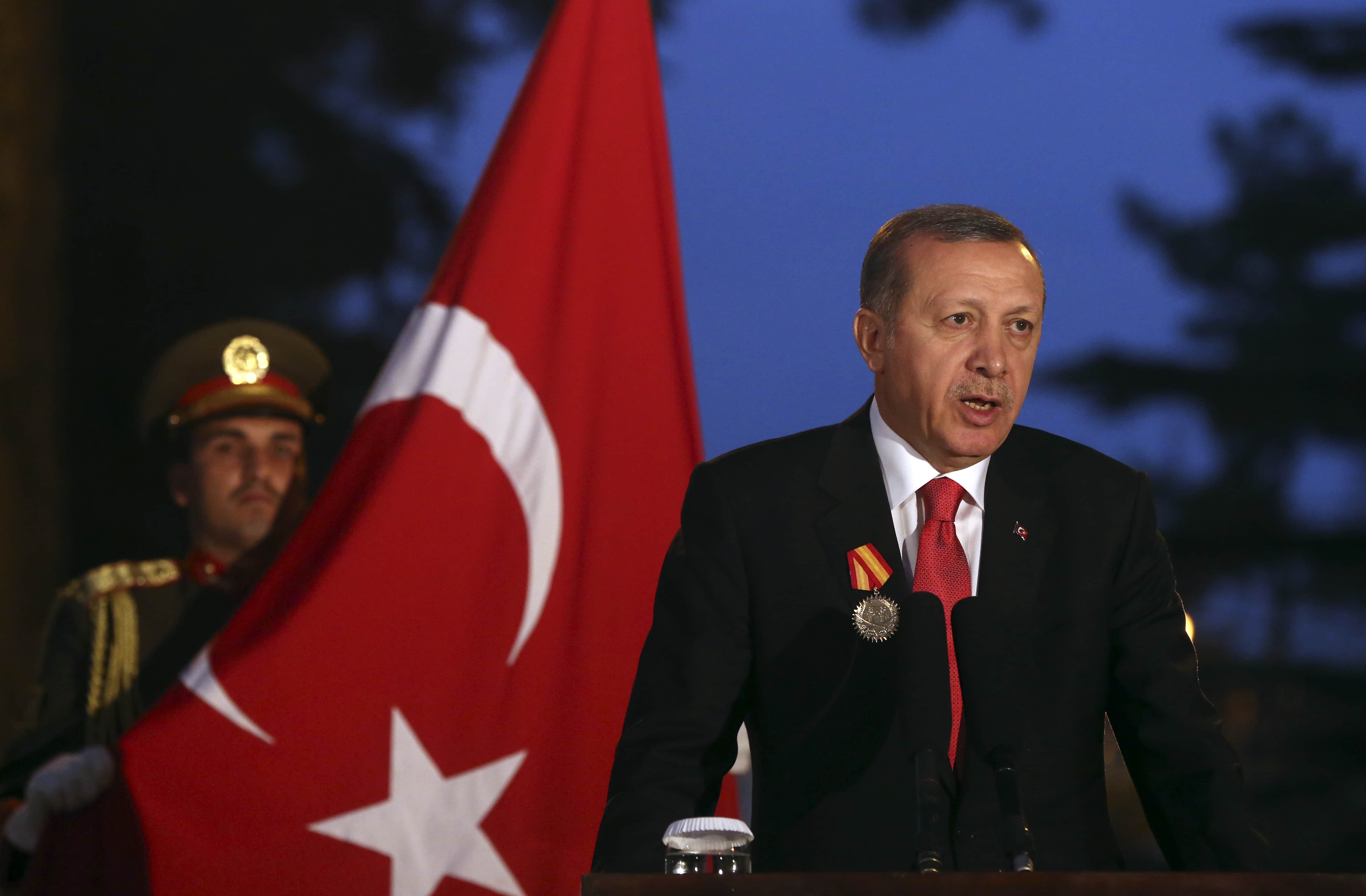 Turkish President Recep Tayyip Erdogan speaks during a news conference with Afghanistan's President Ashraf Ghani Ahmadzai, at the presidential palace in Kabul, Afghanistan, 18 October 2014, AP Photo/Massoud Hossaini