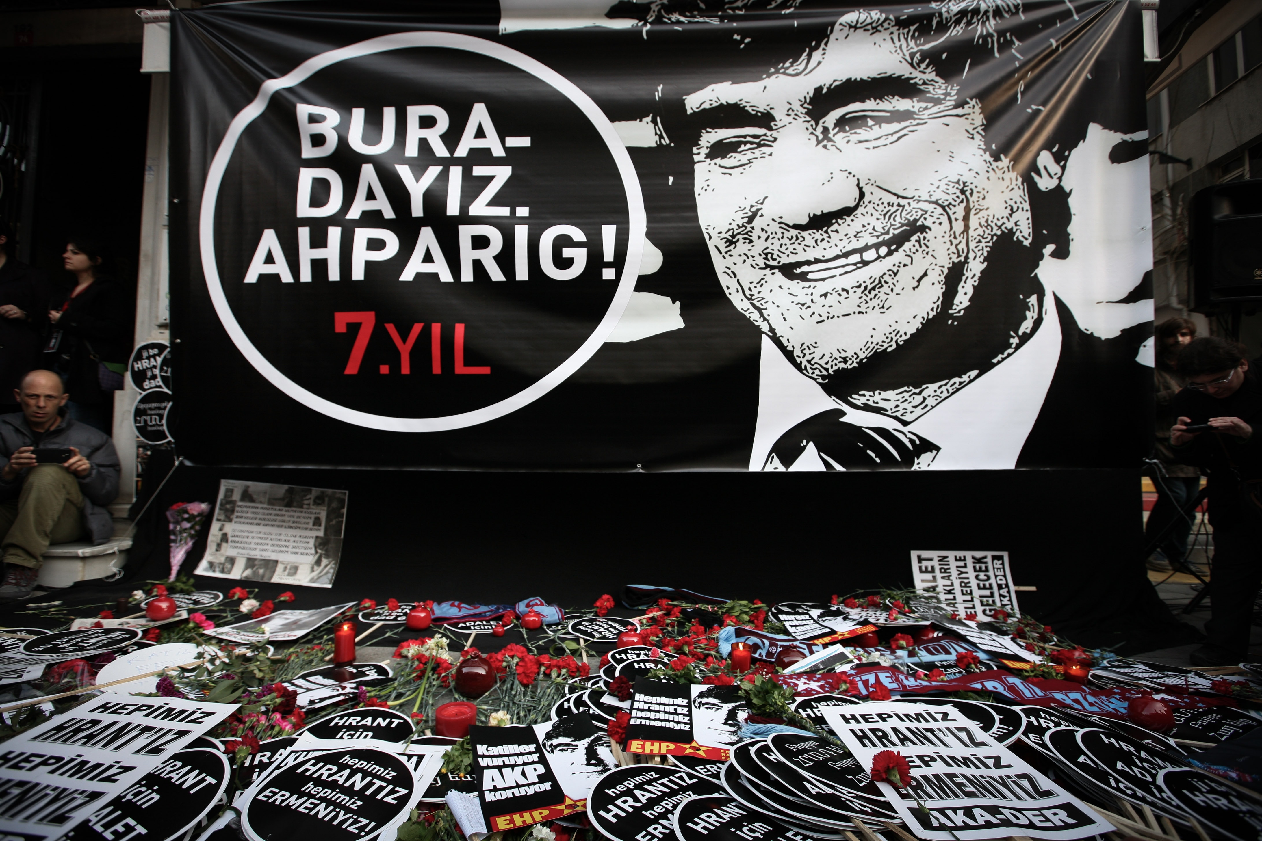 Thousands of protesters gather around a banner thar reads "we are here brother!" to mark the seventh anniversary of Turkish-Armenian journalist Hrant Dink's murder in Istanbul, 19 January 2014, AP Photo/Emrah Gure