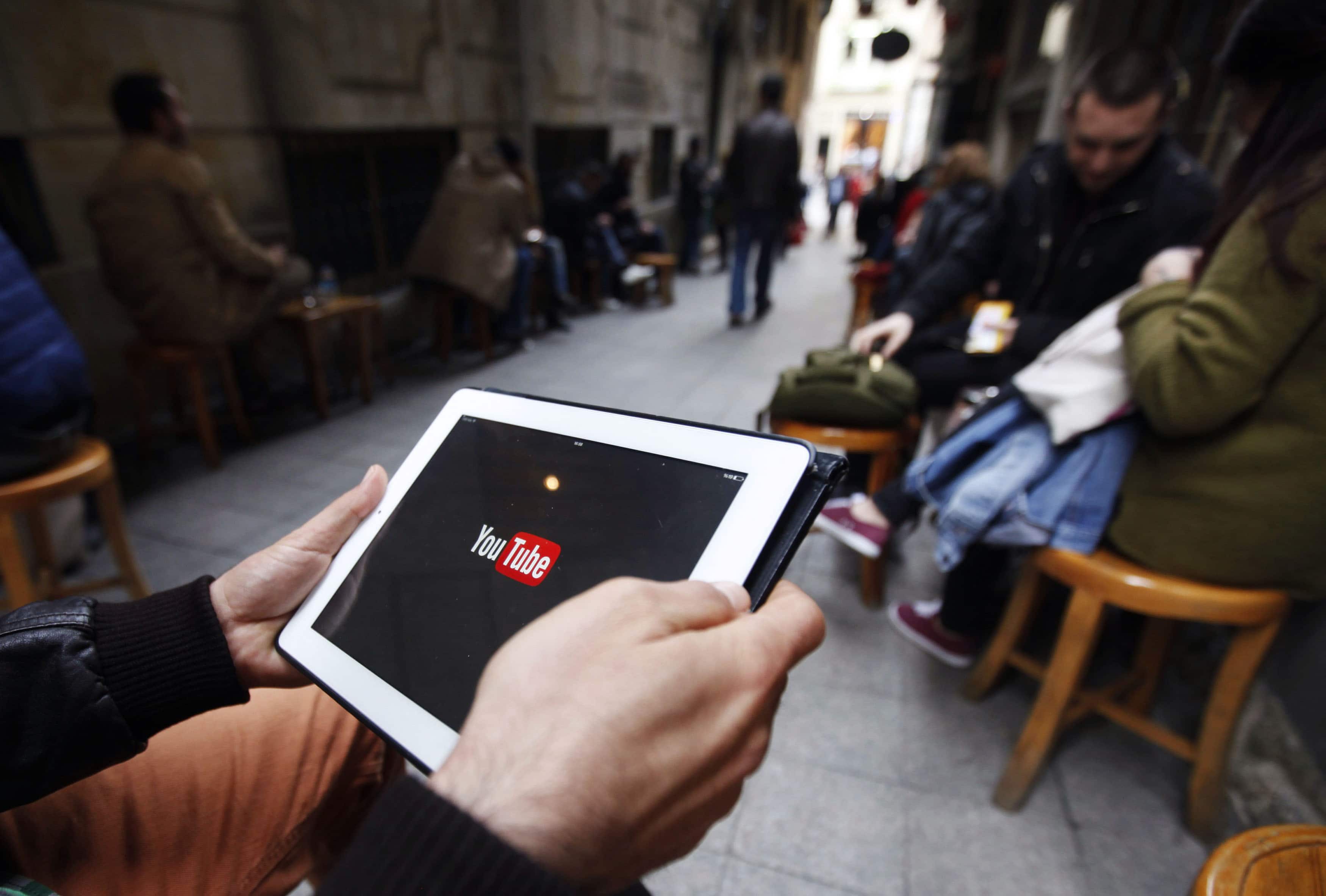 A man tries to connect to YouTube at a cafe in Istanbul, 27 March 2014, REUTERS/Osman Orsal