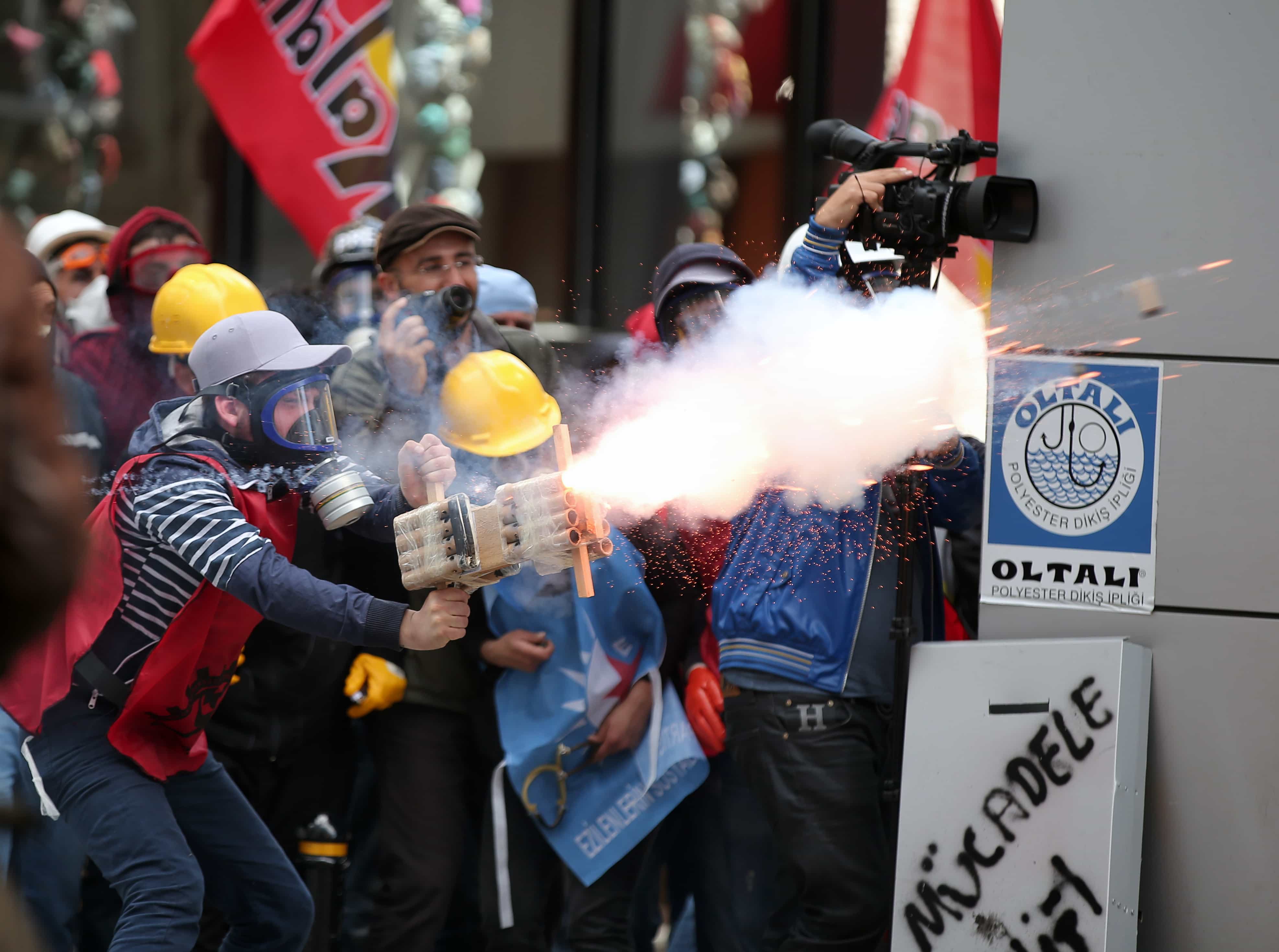 Riot police use water cannons and teargas to disperse thousands of people trying to reach Taksim Square to celebrate May Day in Istanbul, 1 May 2014. , AP Photo/Emrah Gurel