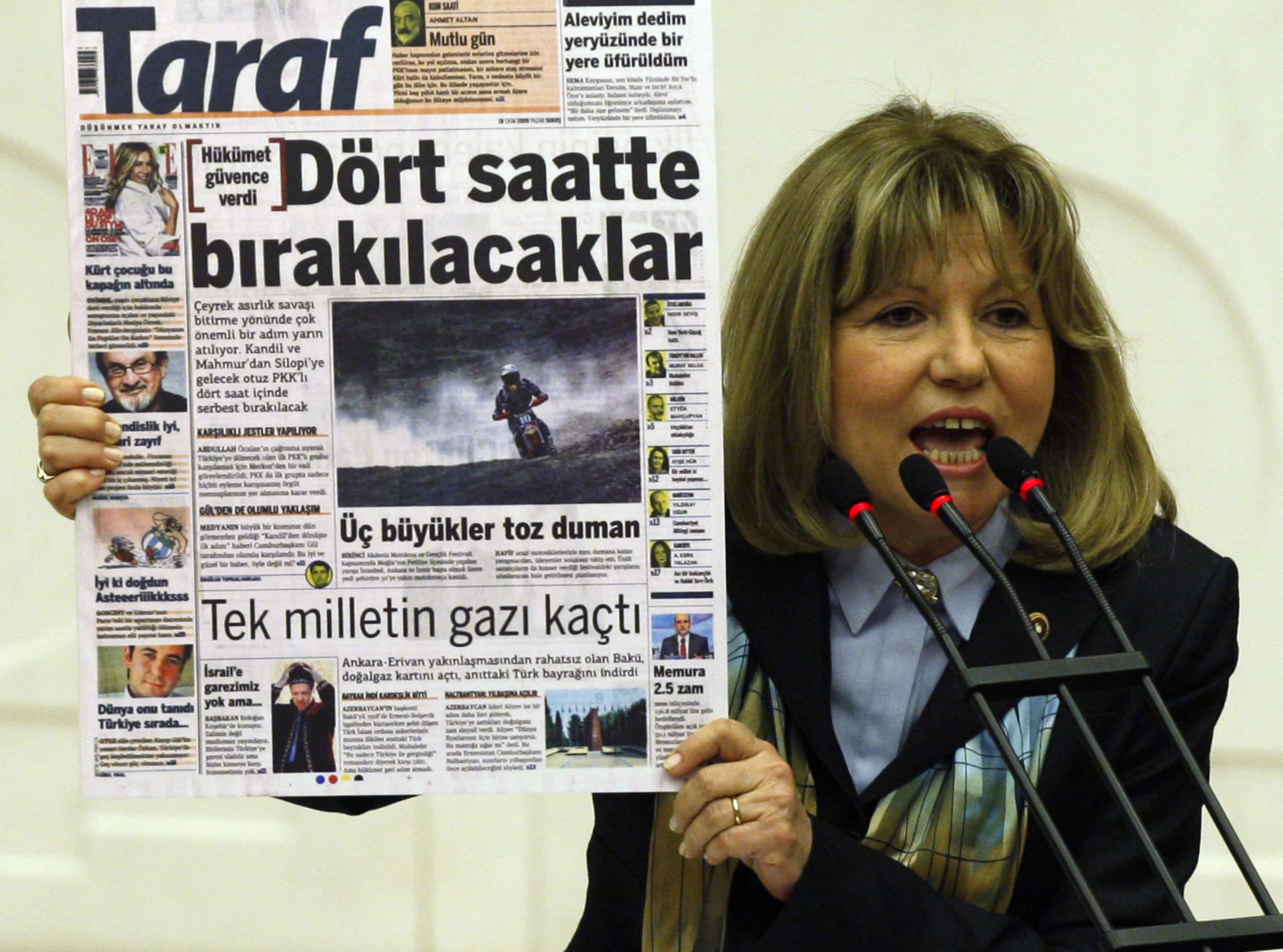 The former opposition Republican People's Party lawmaker Nur Serter shows a copy of Taraf newspaper during a debate in parliament on 25 February 2010, AP Photo/Burhan Ozbilici