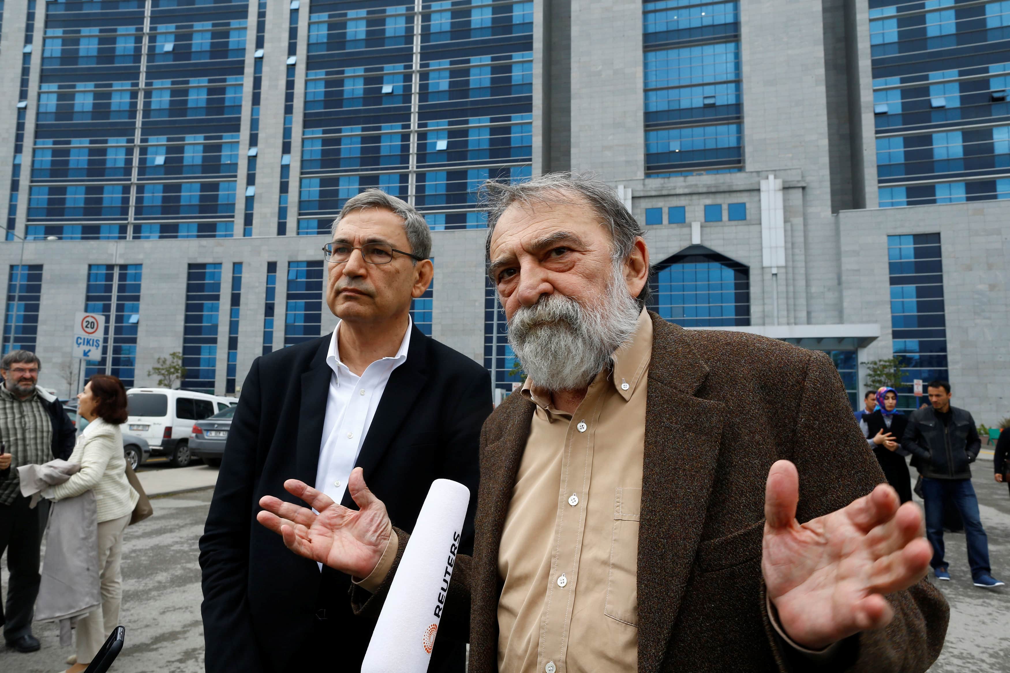 Turkish writer, columnist and academic Murat Belge (R) and Turkish author Orhan Pamuk leave Kartal Justice Palace after Belge appeared in court on charges of insulting Turkish President Tayyip Erdogan in Istanbul, 3 May 2016, REUTERS/Osman Orsal