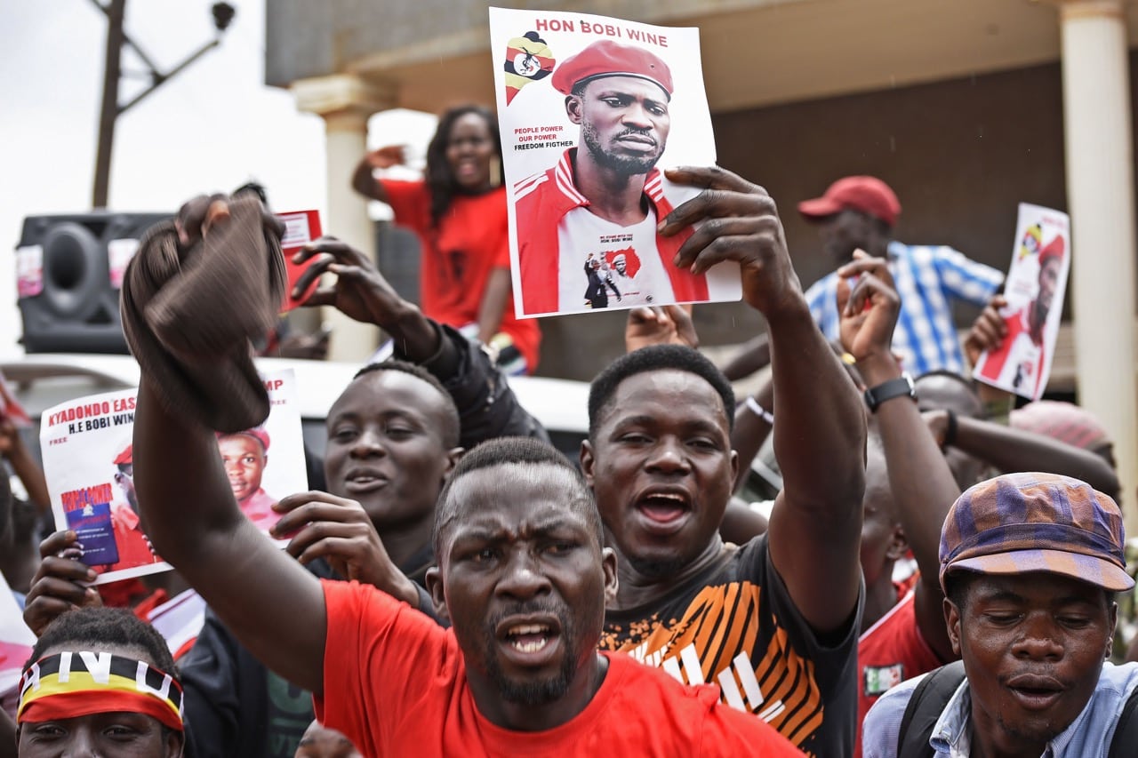 Supporters of detained singer-turned-politican Bobi Wine react to news that he had been granted bail, in Kampala, Uganda, 27 August 2018, ISAAC KASAMANI/AFP/Getty Images