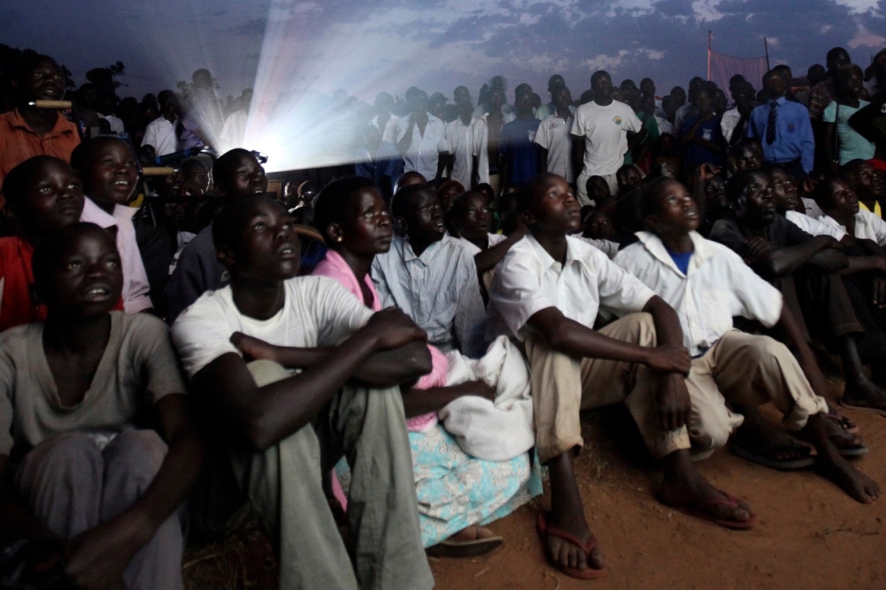 Residents gather to watch a film in Lira district, north of Uganda's capital Kampala, 13 March 2012, REUTERS/James Akena