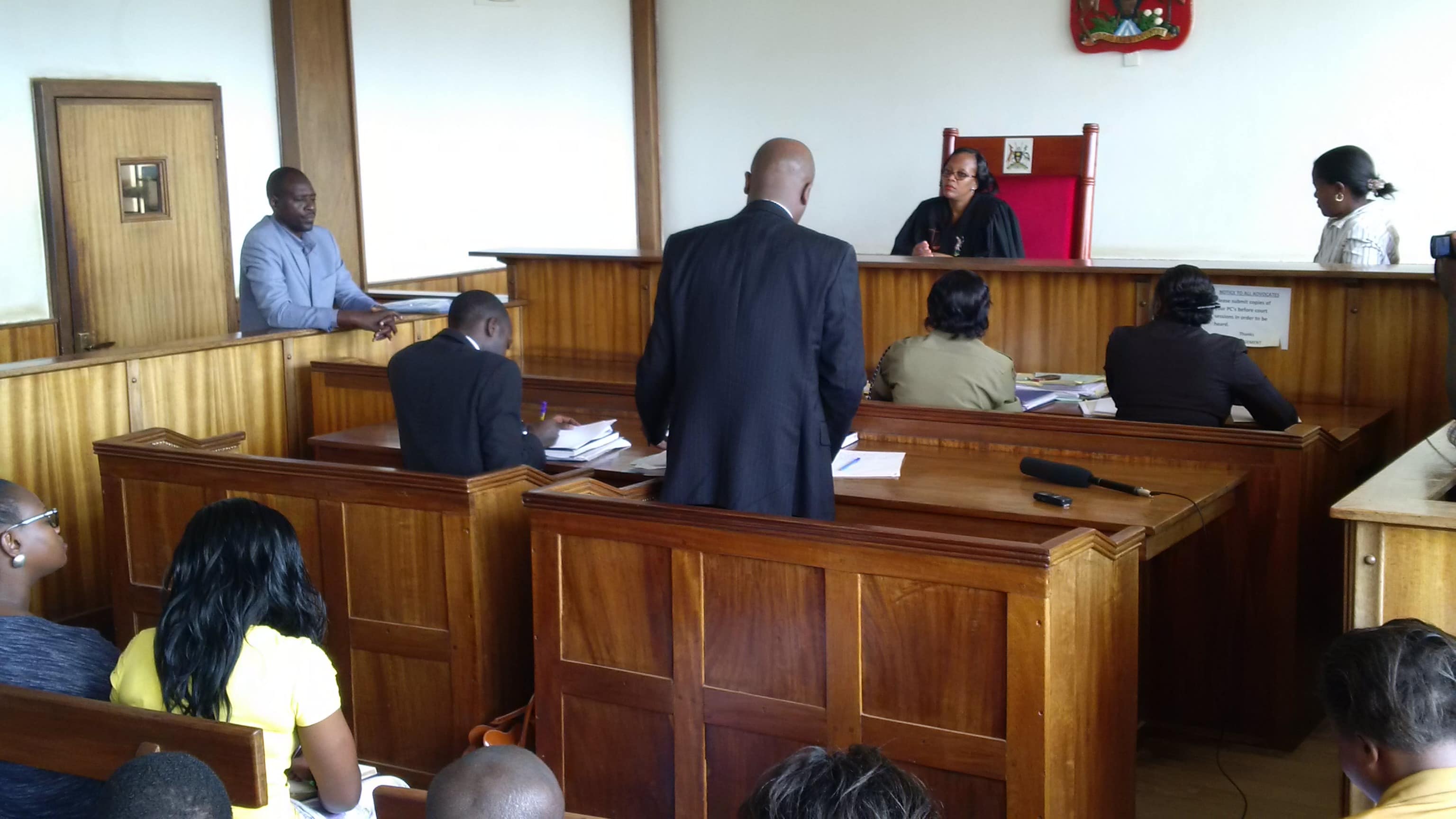 Police officer Joram Mwesigye standing in the dock during a court session, Emmanuel Magambo