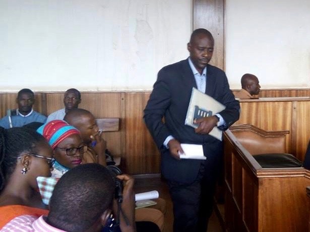Joram Mwesigye, the police officer accused of assaulting a journalist, inside the courtroom , Francis Tumwekwasize