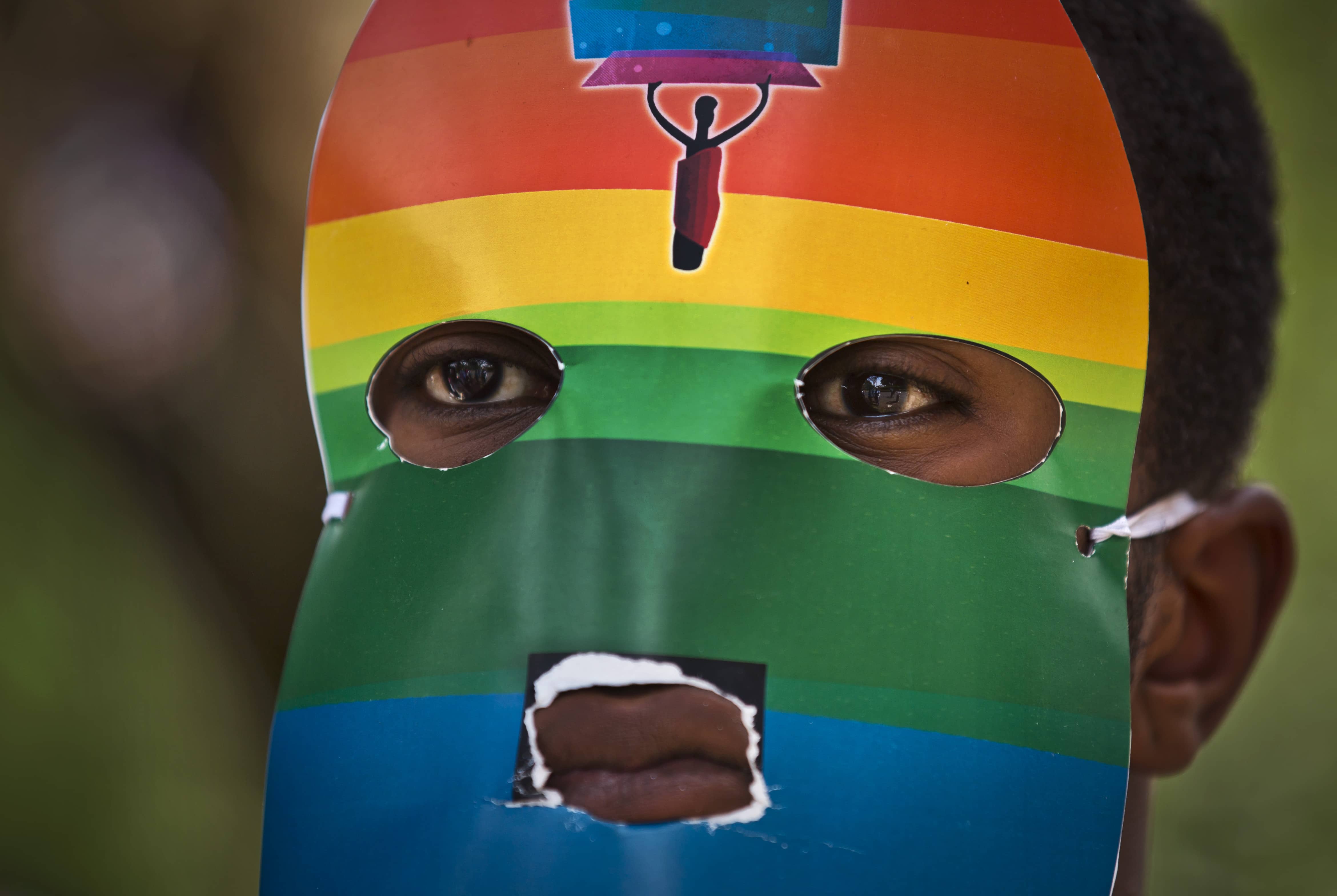A person wears a mask as Kenyan LGBT rights supporters protest against Uganda's increasingly tough stance against homosexuality, outside the Uganda High Commission in Kenya, 10 February 2014., AP Photo/Ben Curtis