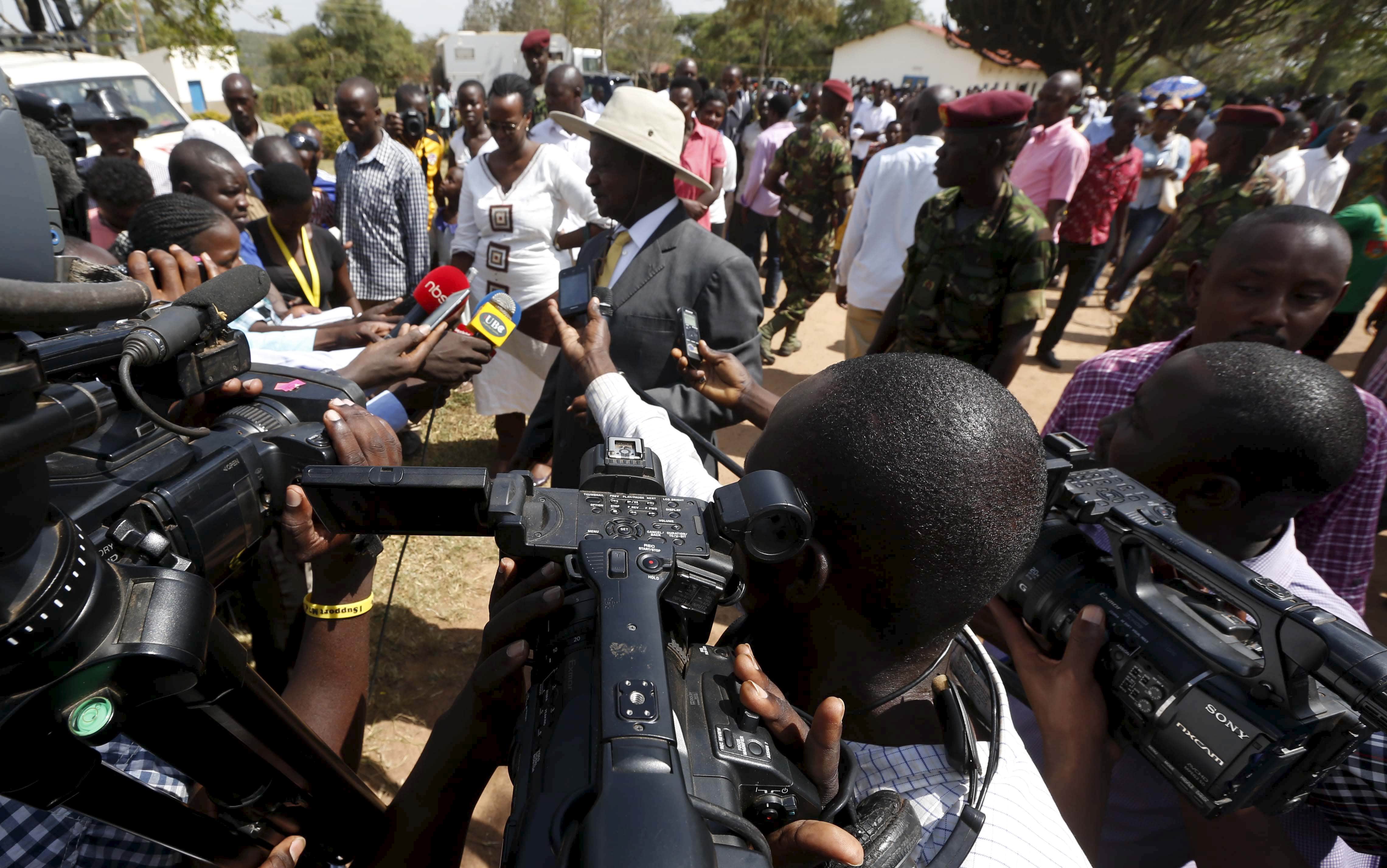 Uganda's incumbent President Yoweri Museveni speaks to the media soon after casting his vote at a polling station during the presidential elections in Kirihura, western Uganda, 18 February 2016, REUTERS/James Akena