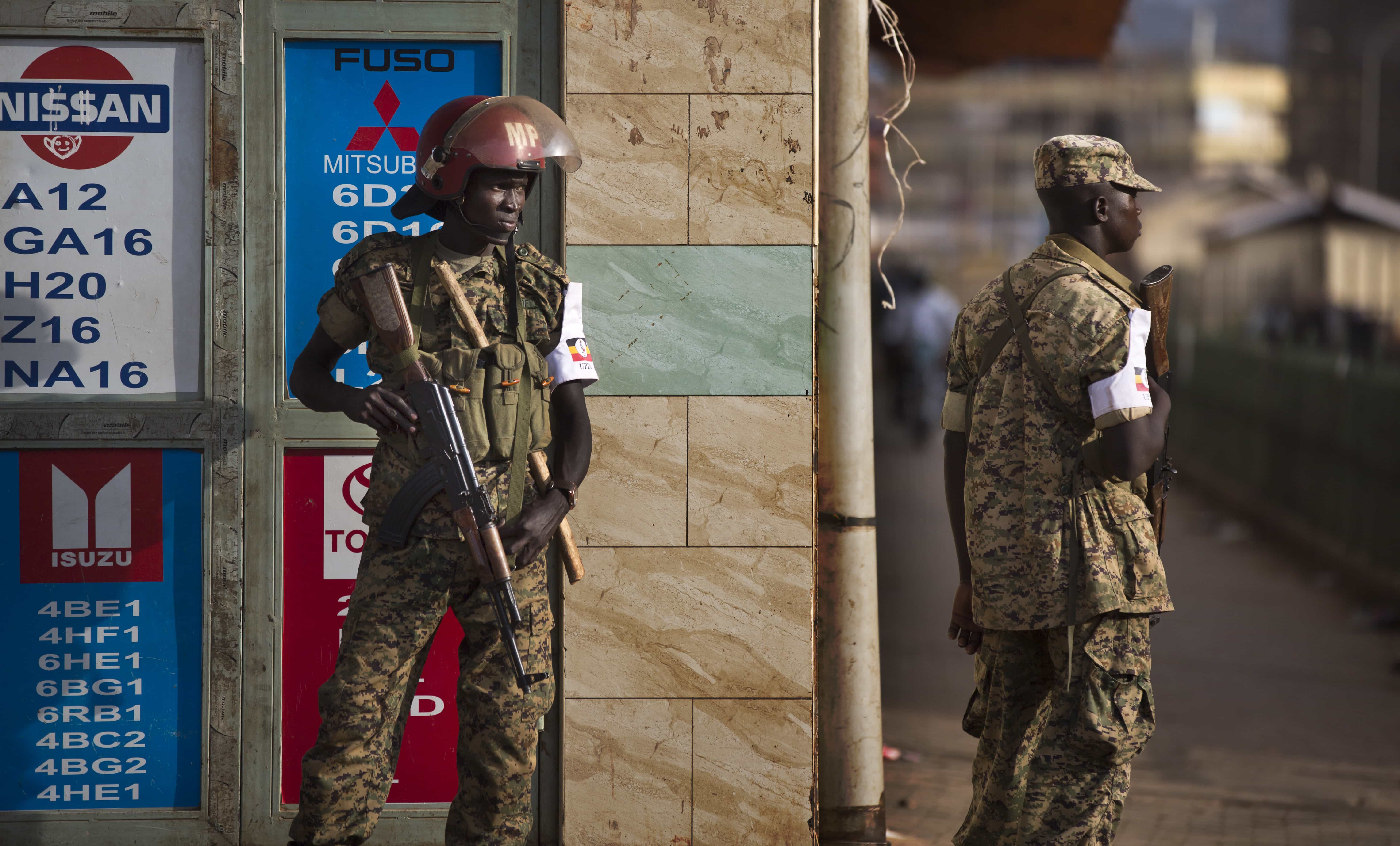 Ugandan military police deploy on the streets shortly after the election result was announced, in downtown Kampala, Uganda, 20 February 2016, AP Photo/Ben Curtis