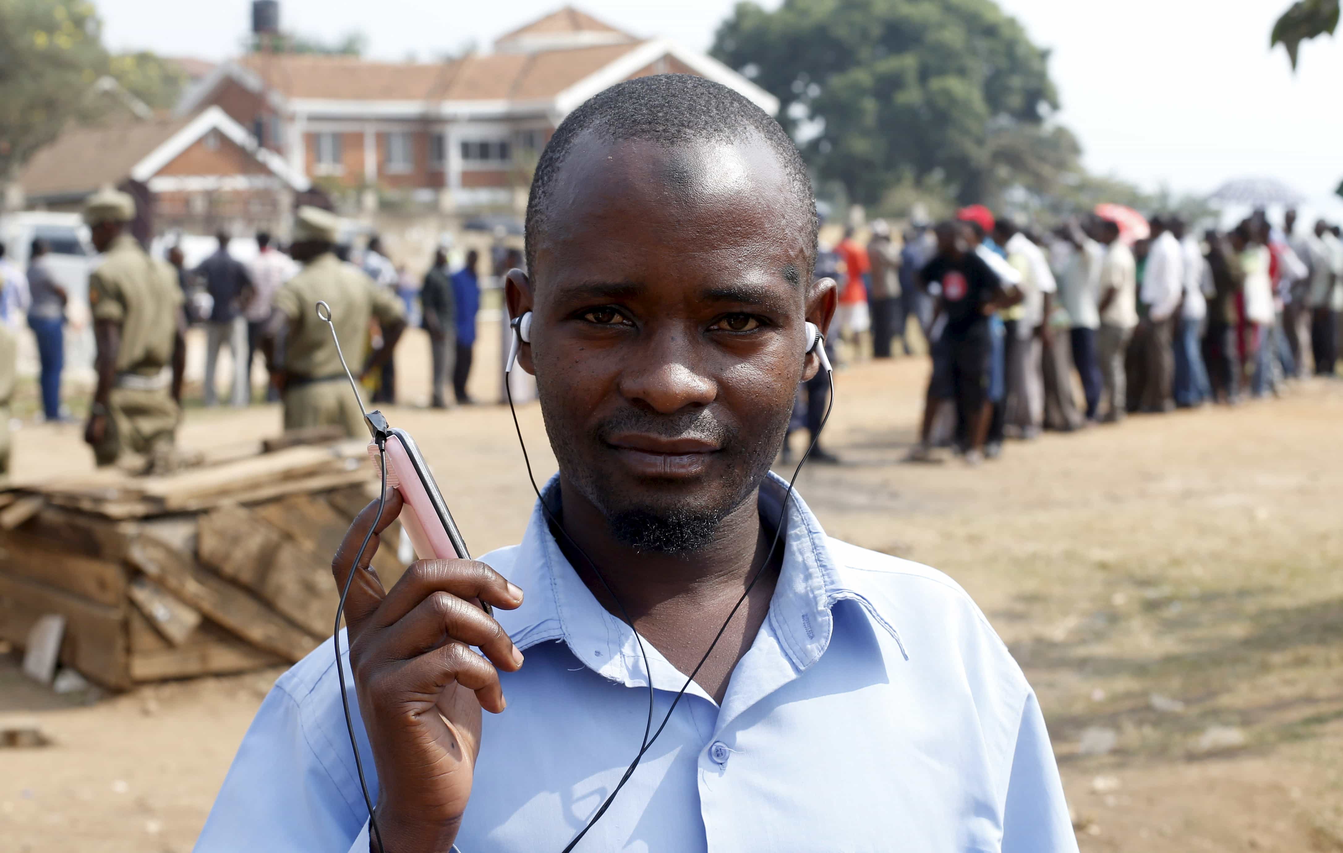 A man listens to elections results on his FM radio in Kampala, Uganda, 19 February 2016, REUTERS/James Akena