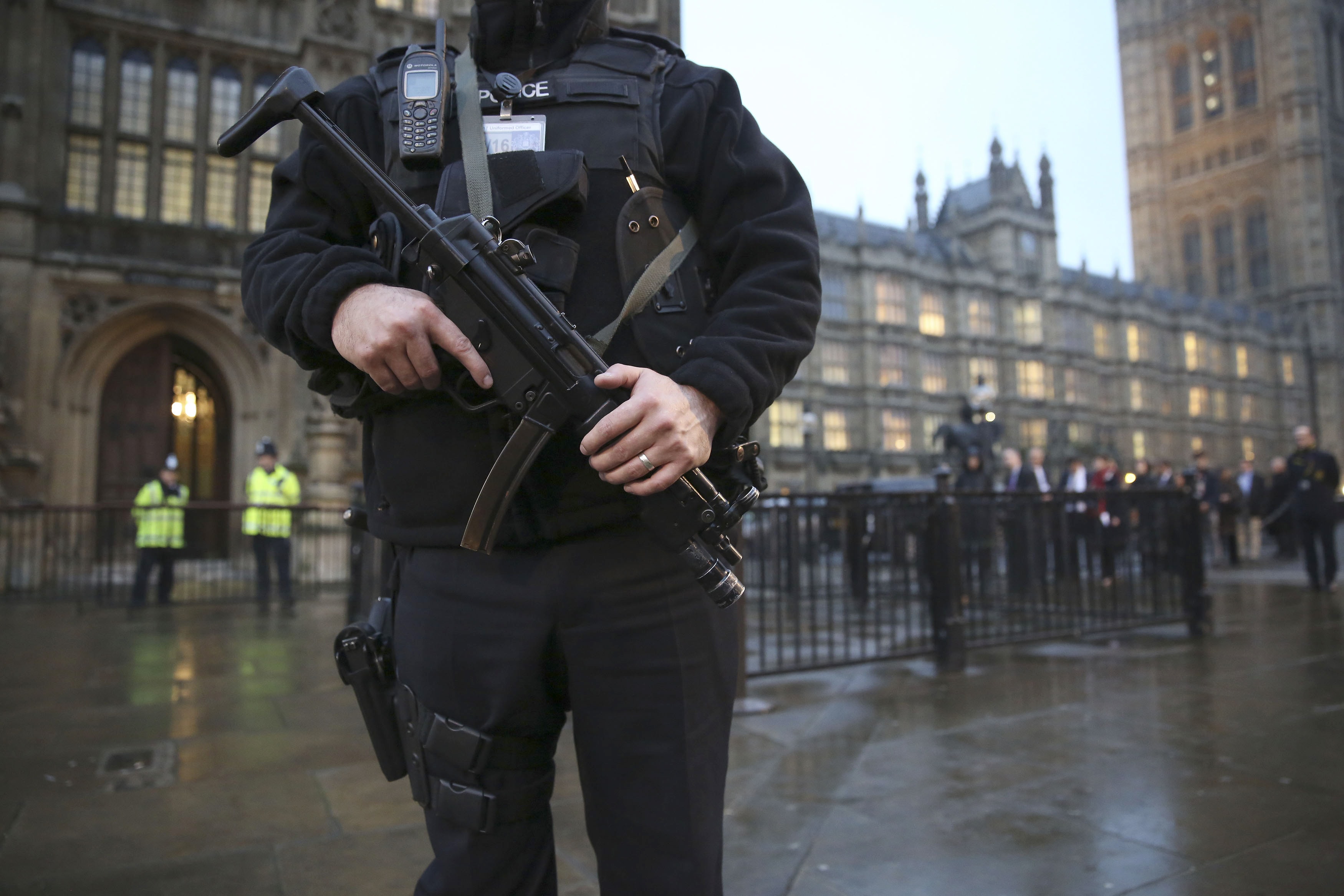 An armed police officer stands outside the Houses of Parliament, central London, 26 November 2014, REUTERS/Paul Hackett