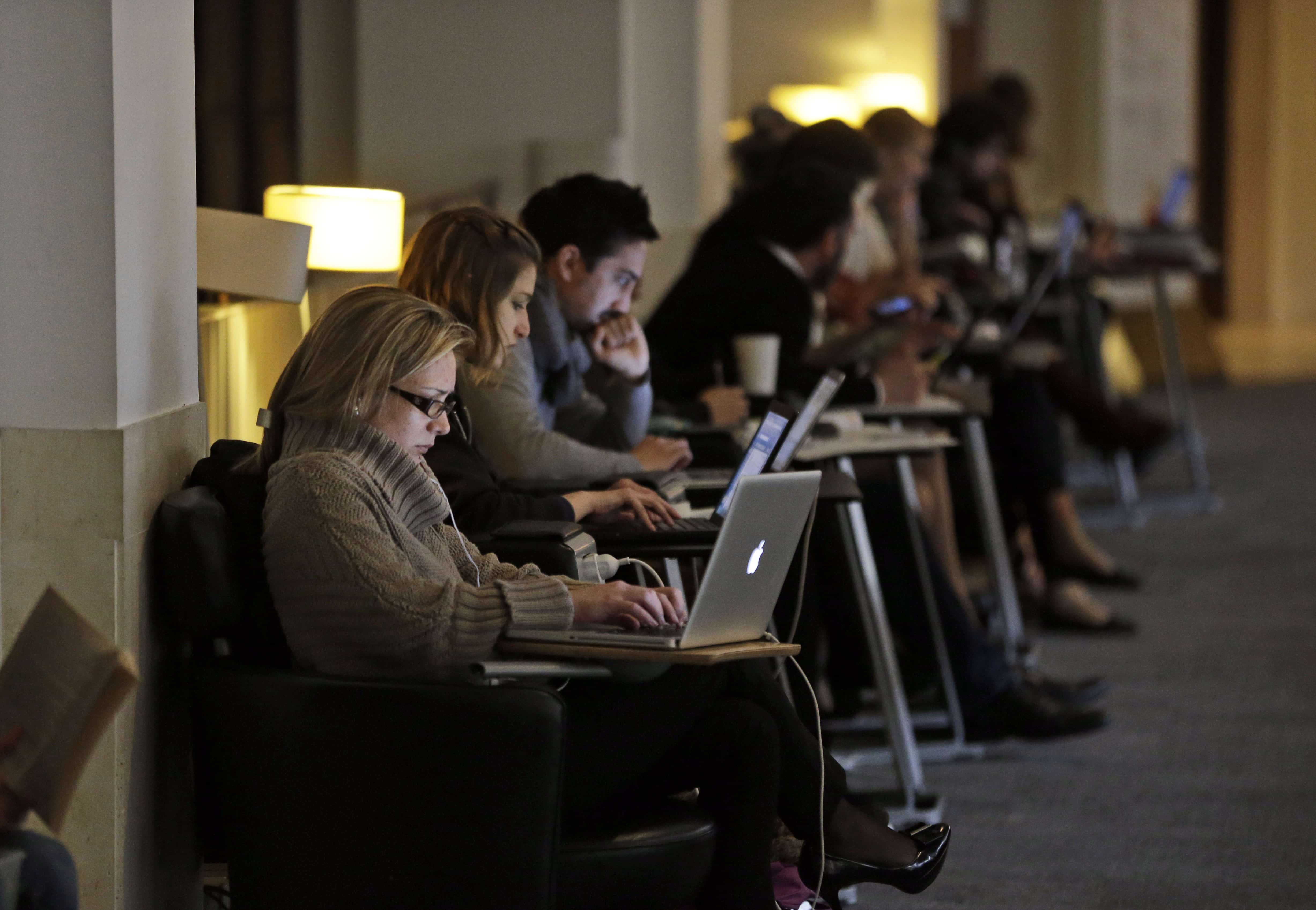 People work on their computers at the British Library in London, 3 April 2013, AP Photo/Lefteris Pitarakis