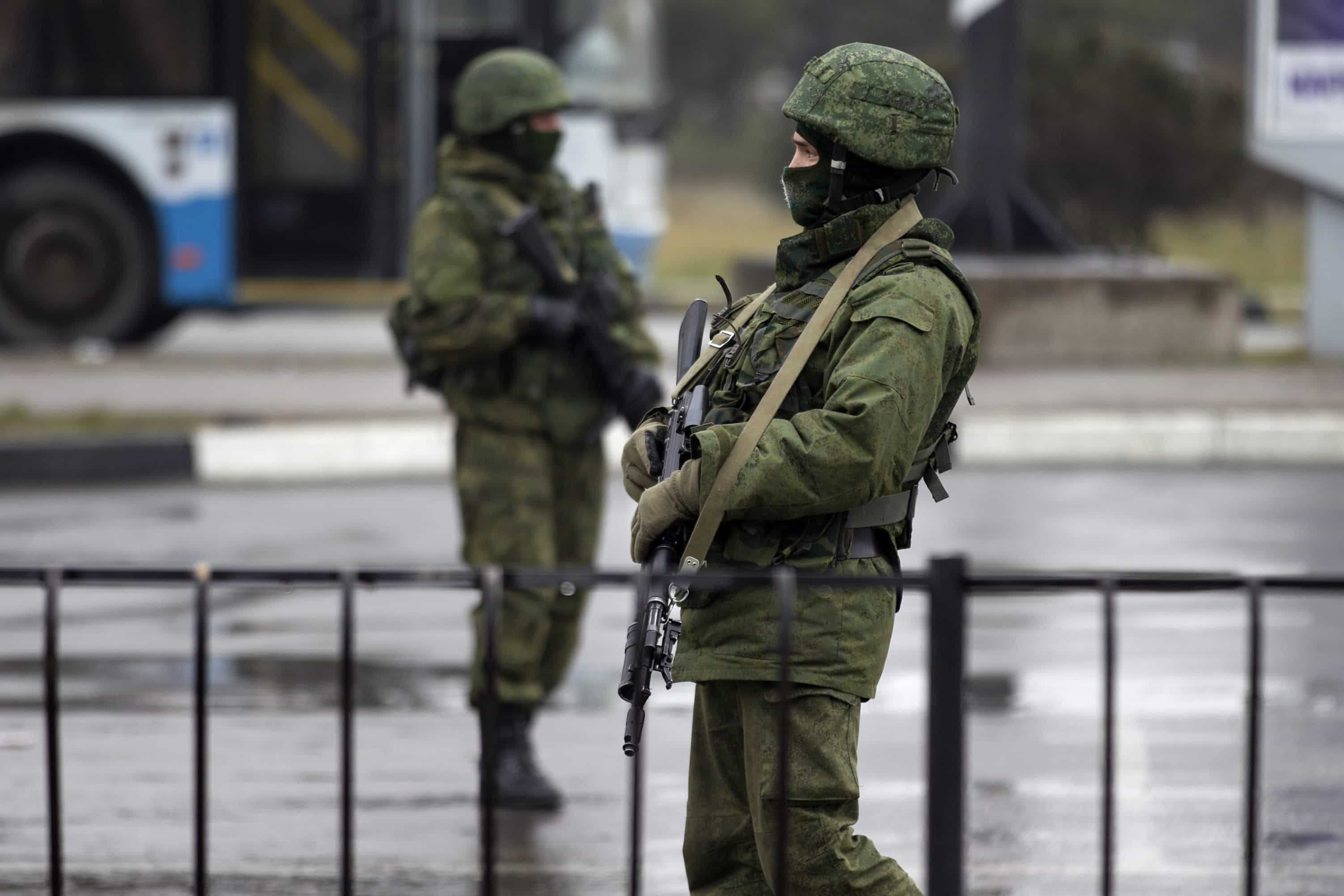 Armed men patrol at the Simferopol airport in the Crimea region February 28, 2014. , REUTERS/Baz Ratner