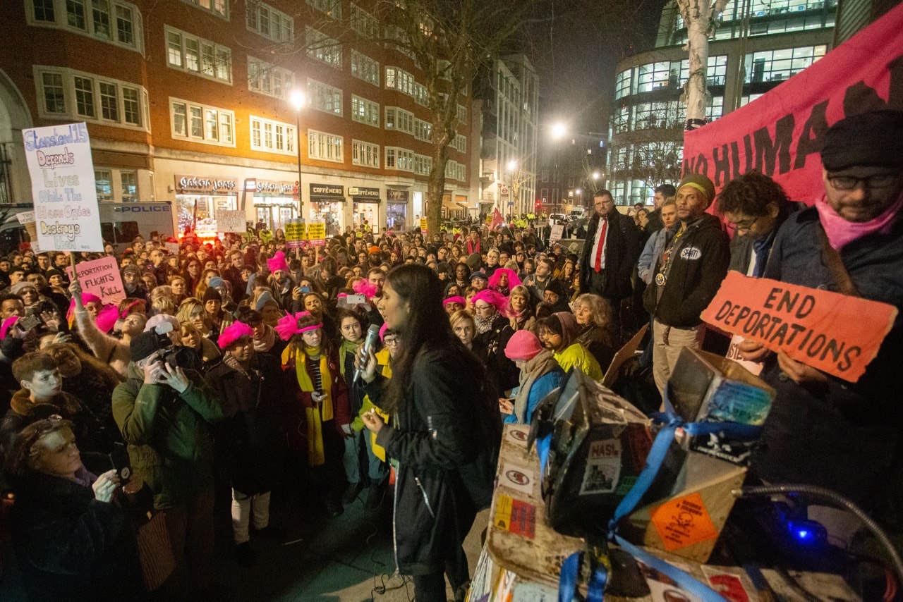 An activist addresses a crowd gathered outside the Home Office to display their anger at the verdict of the Stanstead 15, in London, UK, 11 December 2018, Ryan Ascroft/SOPA Images/LightRocket via Getty Images