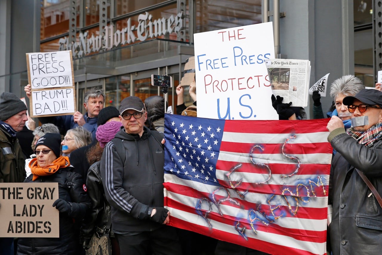 Demonstrators stand in a show of solidarity with the press in front of "The New York Times" building in New York, 26 February 2017, AP Photo/Kathy Willens