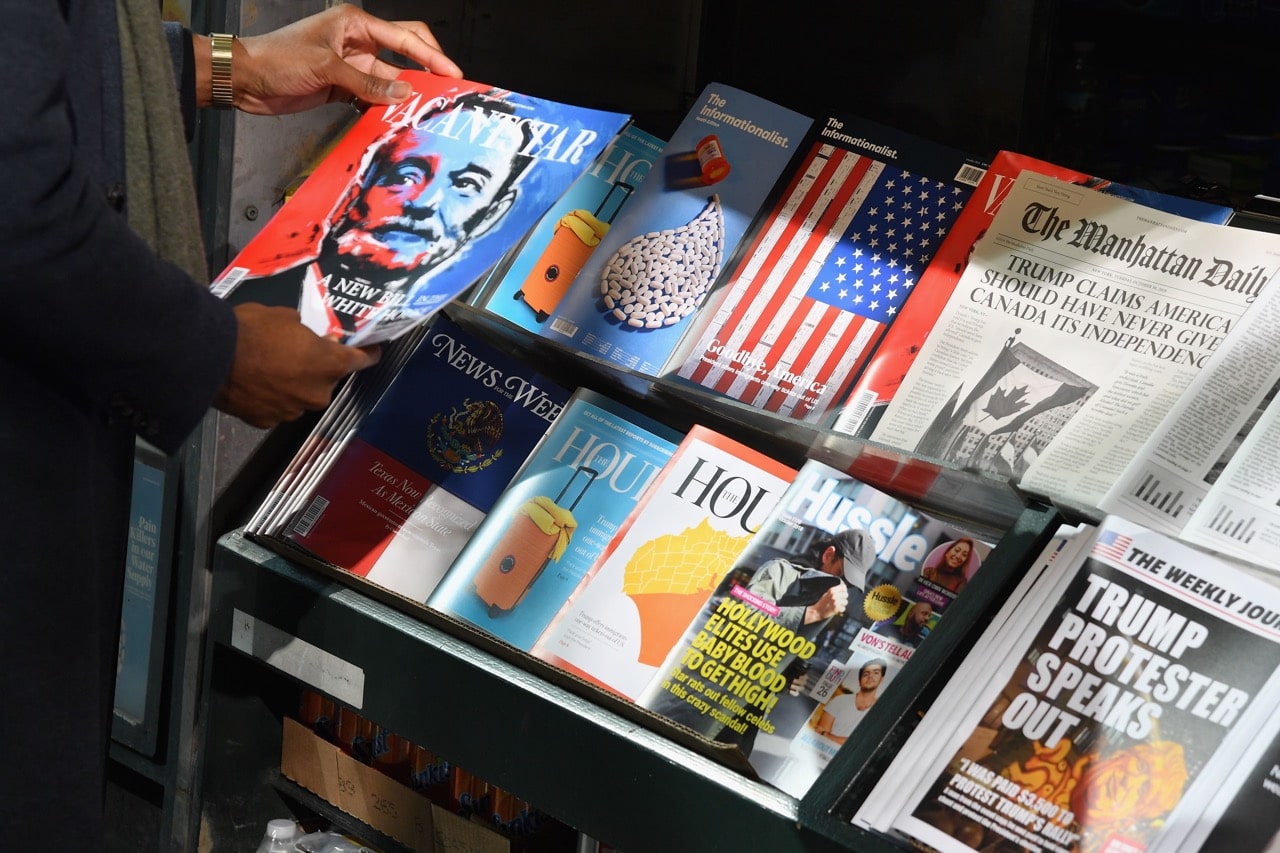 A newsstand set up by the Columbia Journalism Review, aiming to educate news consumers about the dangers of disinformation in the lead-up to the US midterm elections, in Manhattan, 30 October 2018, ANGELA WEISS/AFP/Getty Images