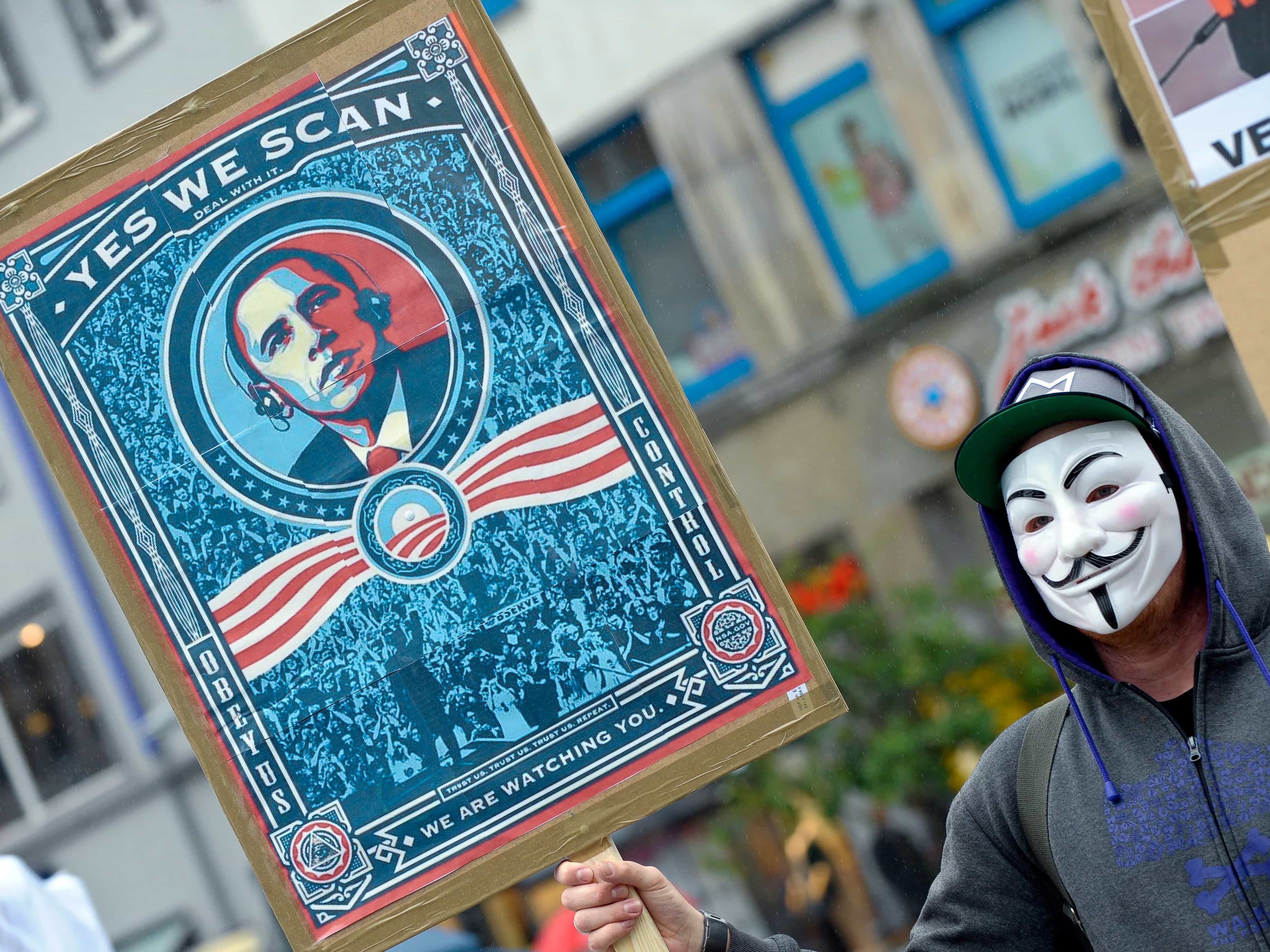 On 29 June 2013 a demonstrator in Hanover, Germany protests against the NSA's surveillance practices, AP Photo/dpa, Peter Steffen