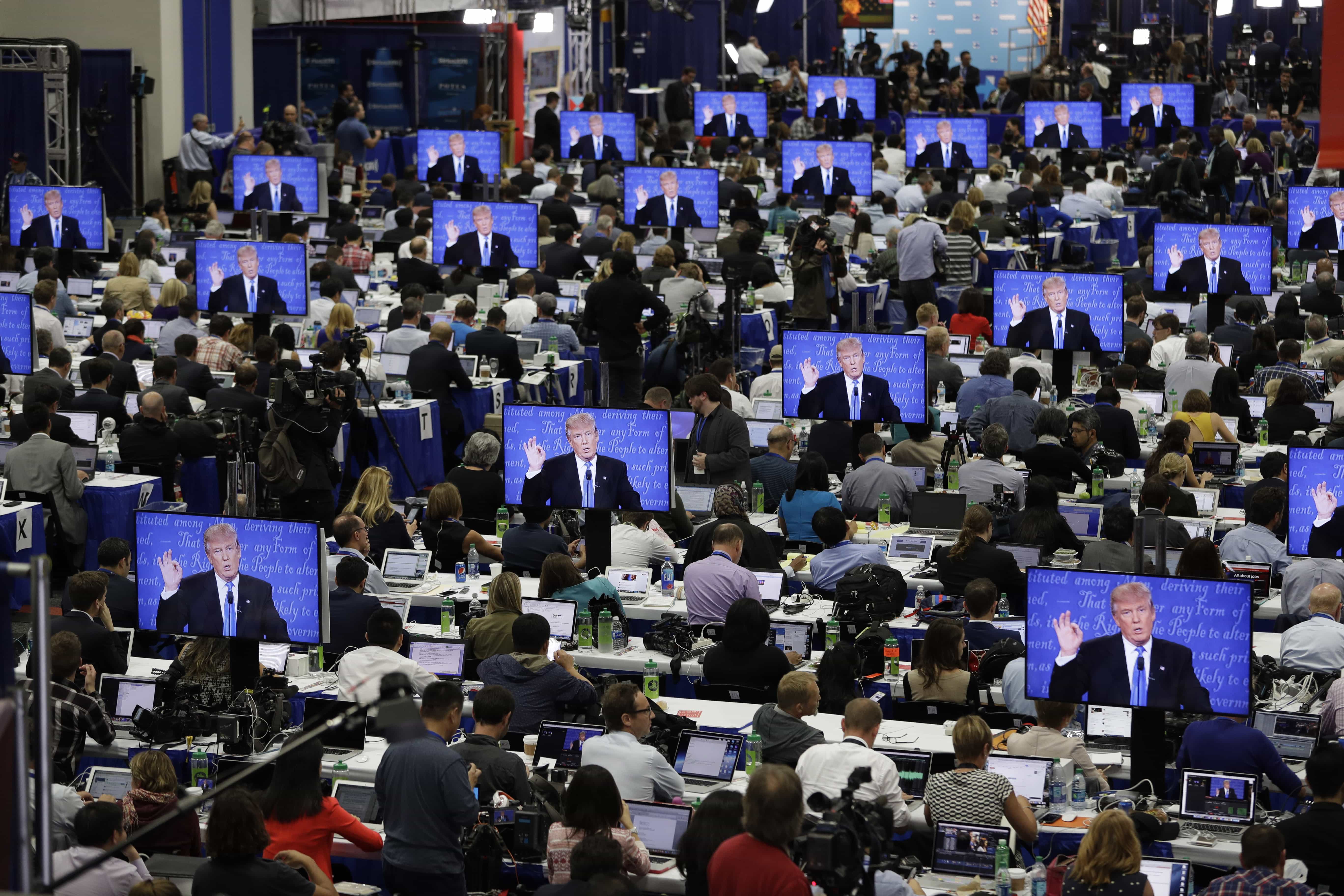 Republican presidential candidate Donald Trump is seen on screens in the media center during the presidential debate on 26 September 2016, AP Photo/John Locher