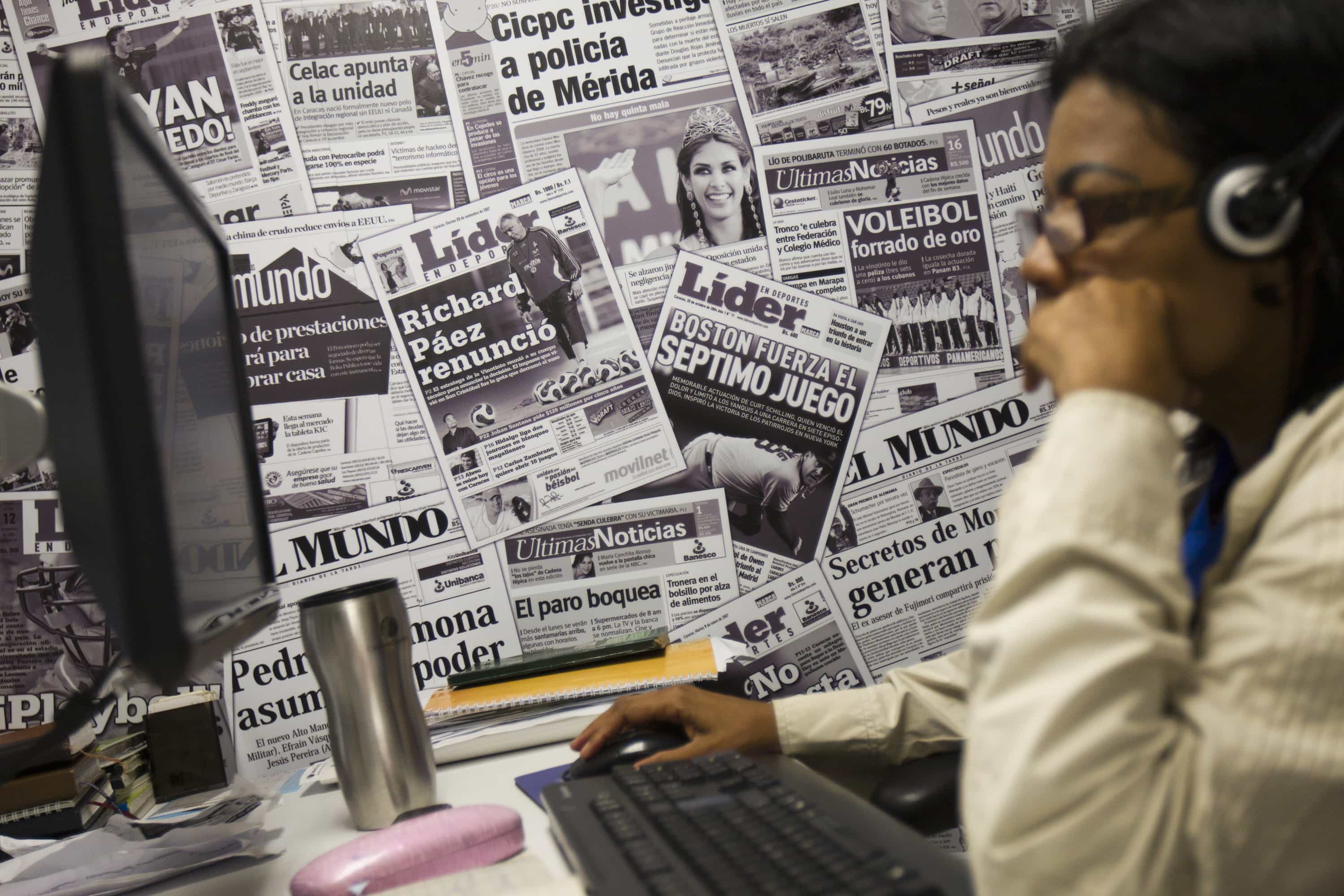 A journalist works at the newsroom of the headquarters of Cadena Capriles in Caracas, 3 June 2013, REUTERS/Carlos Garcia Rawlins