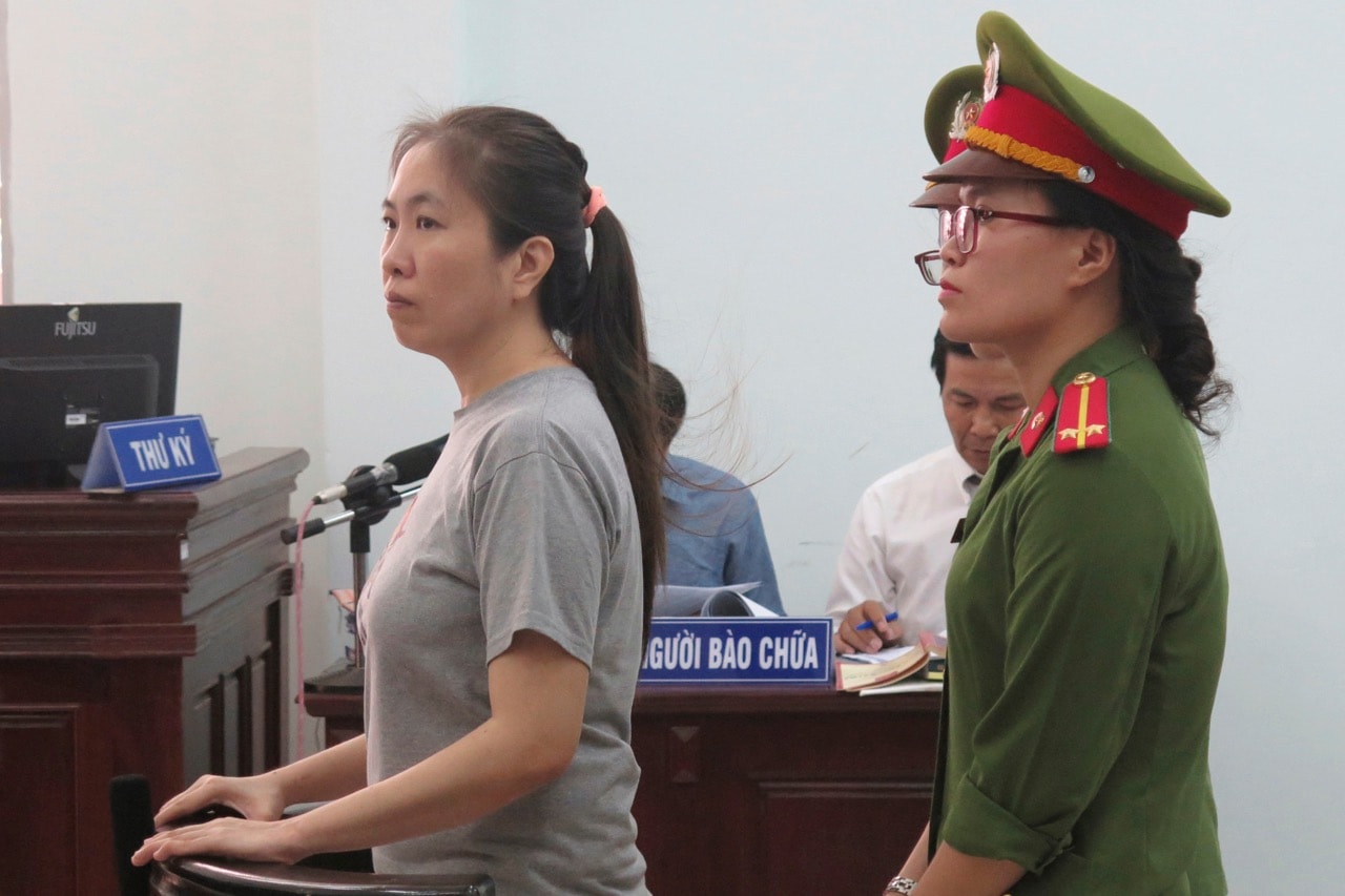 Prominent blogger "Mother Mushroom, left, stands trial in the province of Khanh Hoa, Vietnam, 29 June 2017, Vietnam News Agency via AP