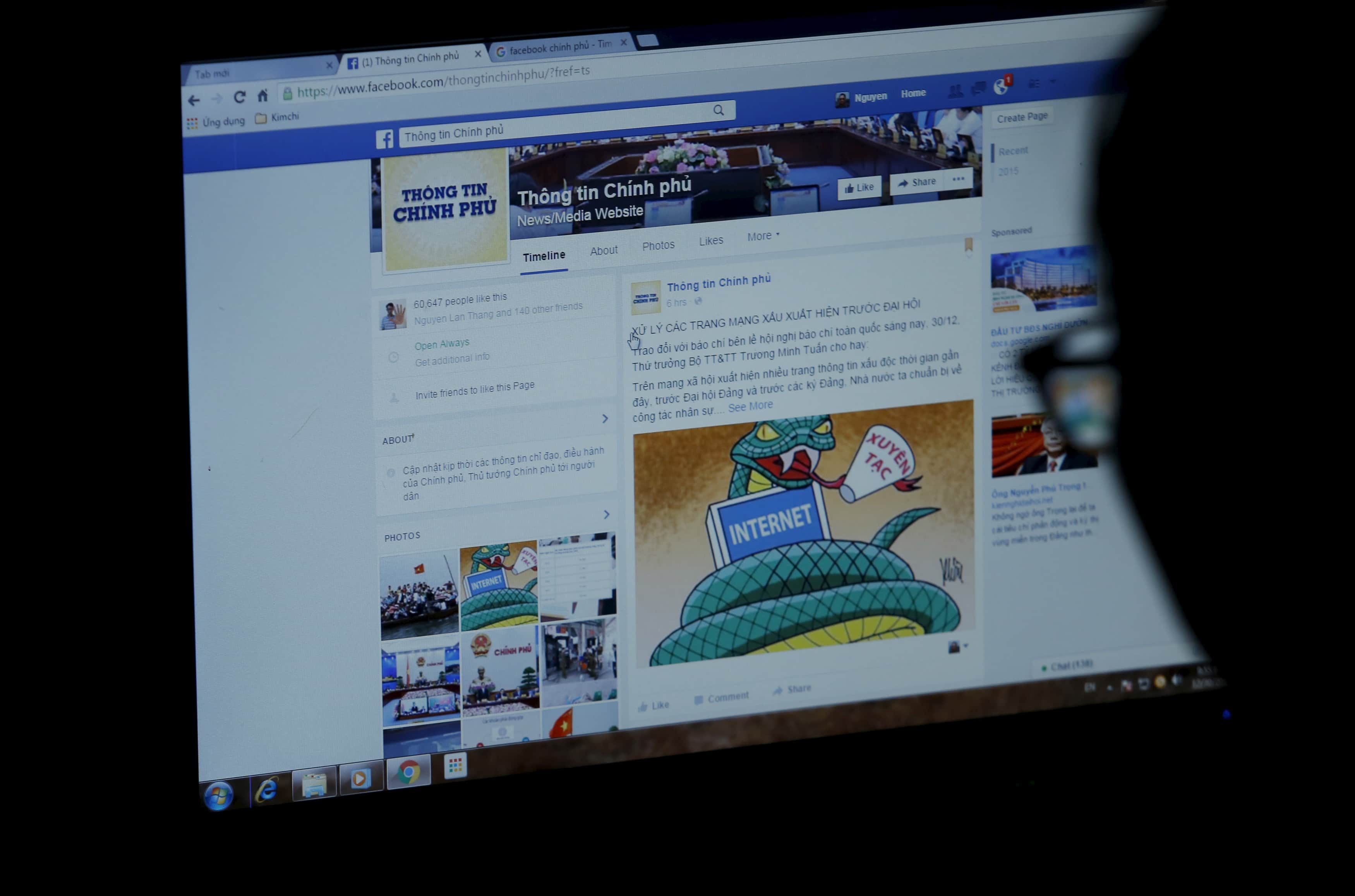 An internet user browses through the Vietnamese government's new Facebook page in Hanoi, 30 December 2015, REUTERS