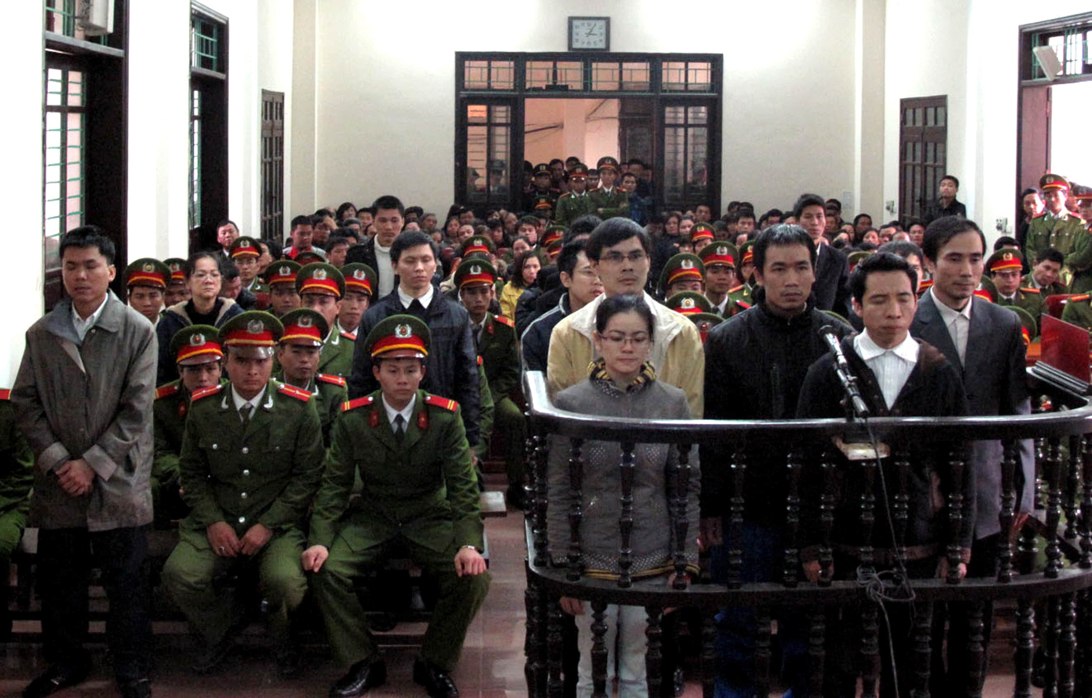 Defendants stand at a court in Nghe An province on 9 January 2013; 13 political activists were found guilty of anti-state crimes and sentenced to prison, REUTERS/Nguyen Van Nhat/Vietnam News Agency