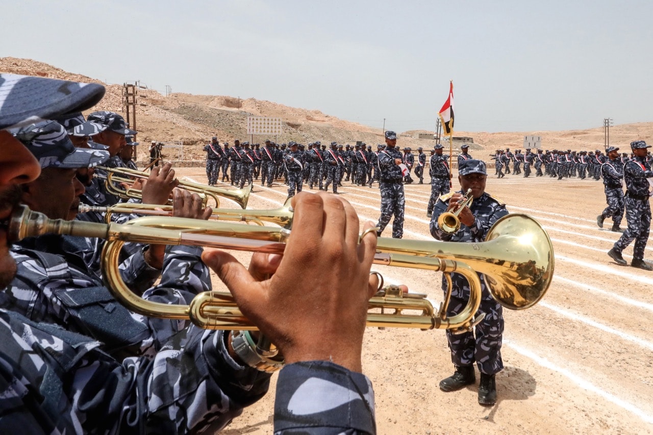 UAE-trained cadets of the Yemeni police play bugles during a graduation ceremony in the port city of Mukalla, capital of Hadramaut province, Yemen, 8 August 2018, KARIM SAHIB/AFP/Getty Images