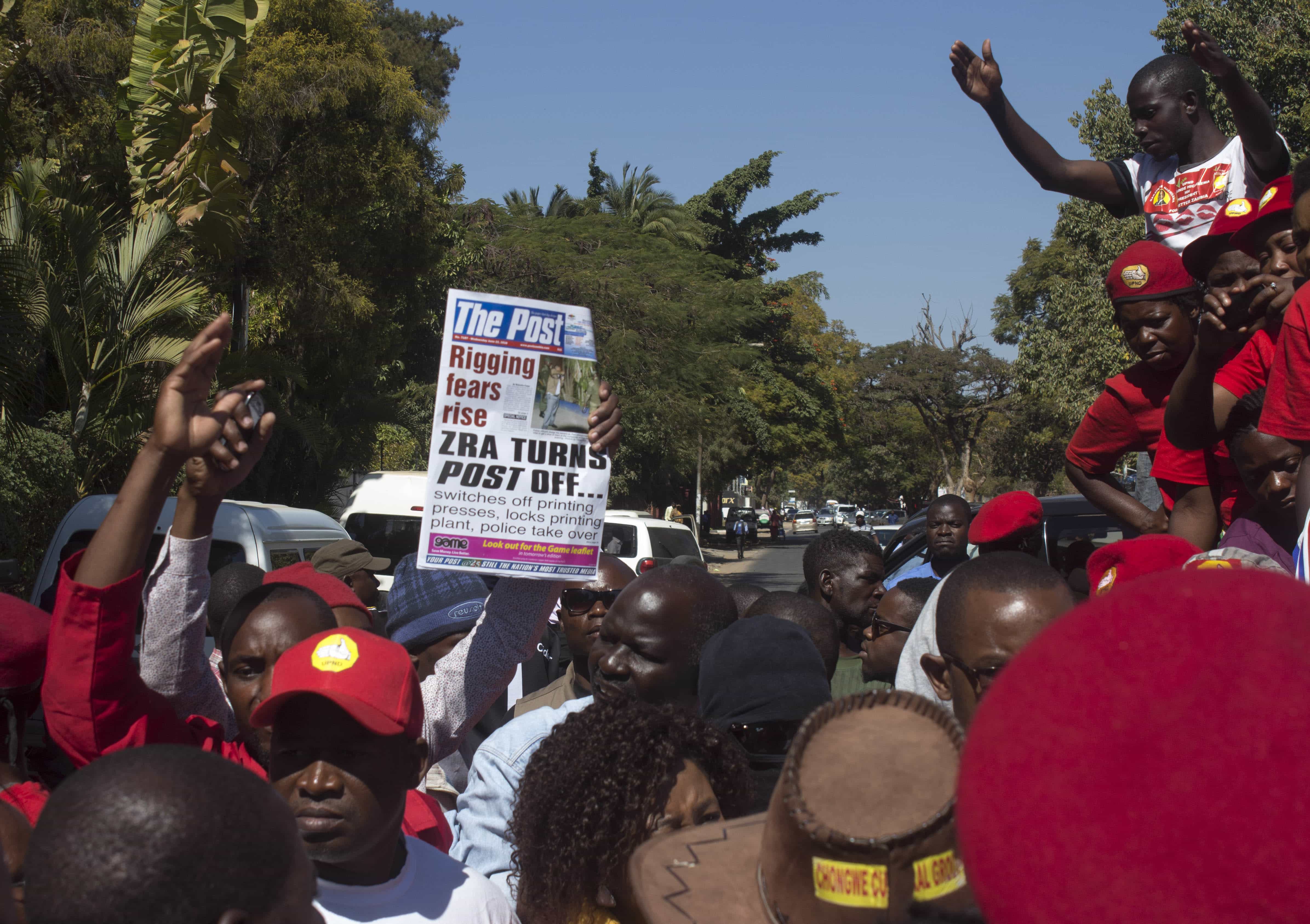 People protest over the closure of "The Post" newspaper in Lusaka, Zambia, 22 June 2016, AP Photo/Moses Mwape