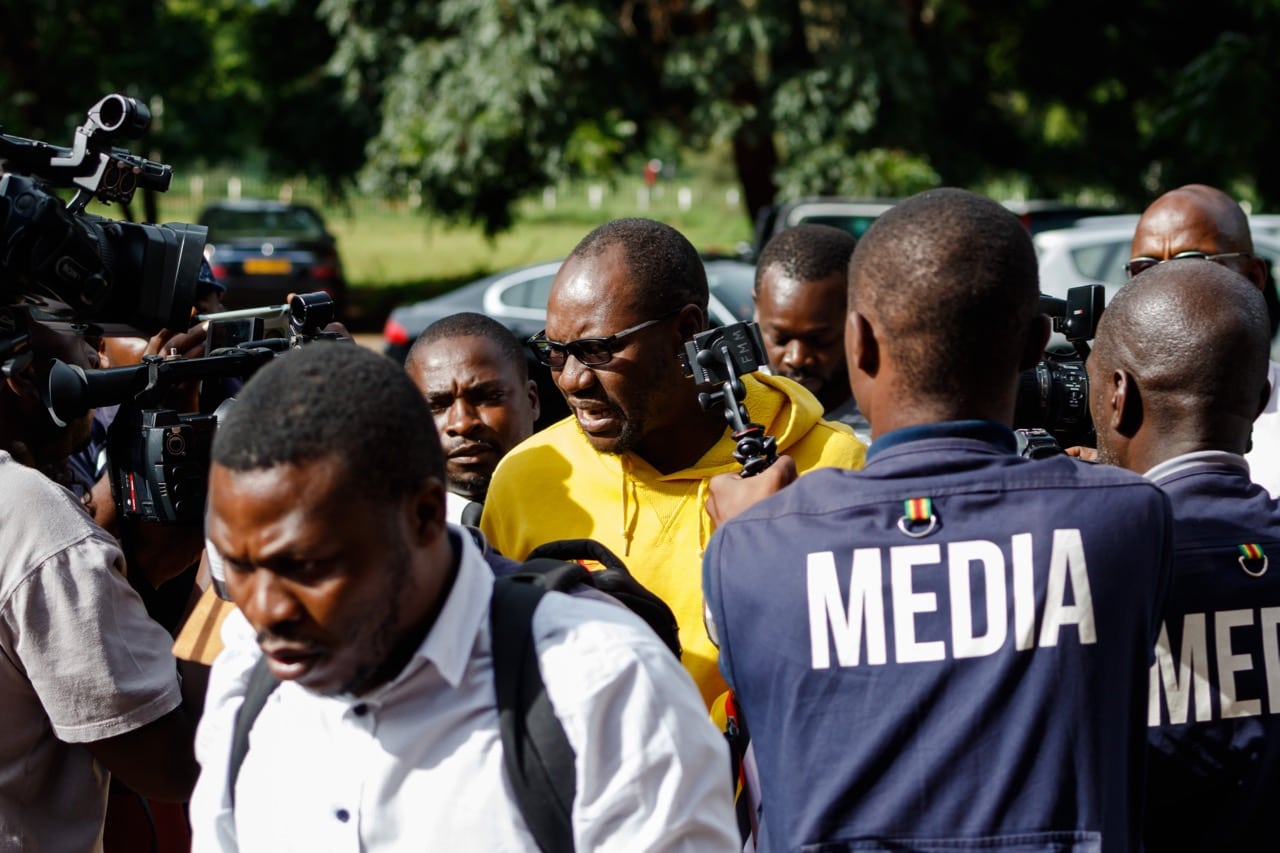 A Zimbabwe activist speaks to the press as he arrives at the Harare Magistrates Court, 17 January 2019, JEKESAI NJIKIZANA/AFP/Getty Images