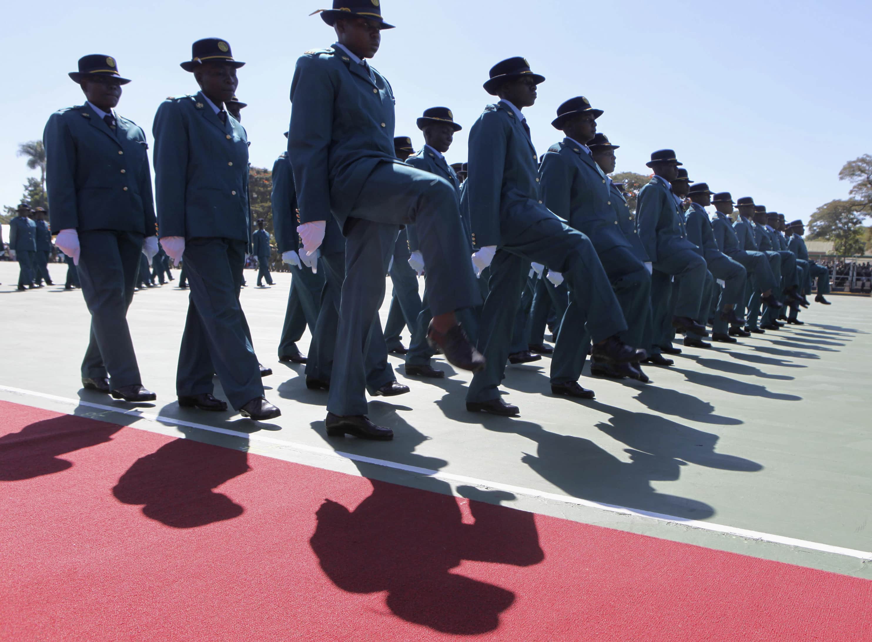 Police officers take part in a graduation ceremony for police recruits in Harare, 29 May 2014, REUTERS/Philimon Bulawayo